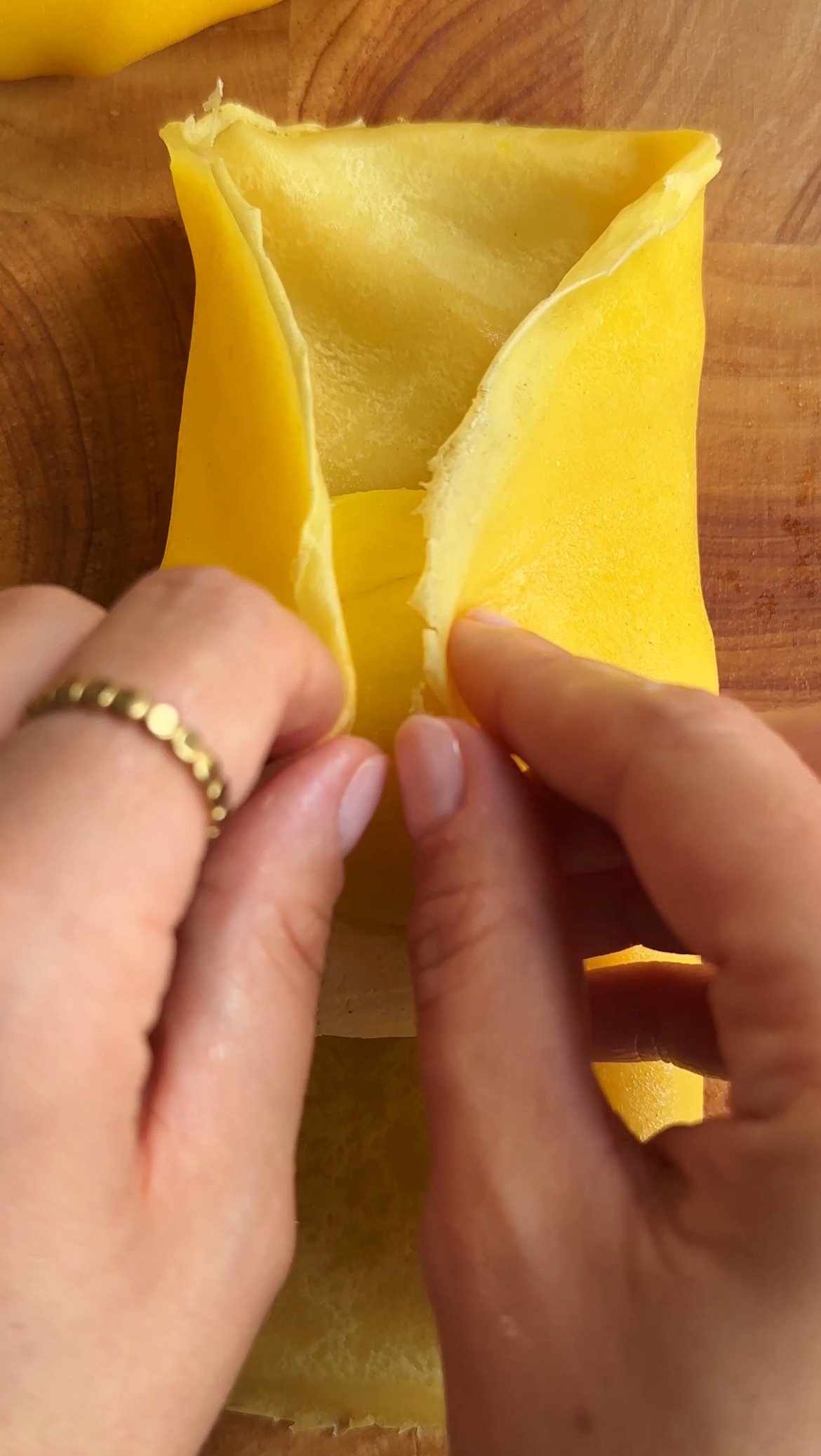 woman folding mango pancakes