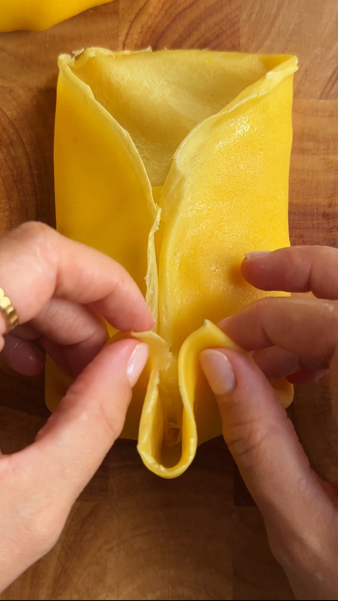 woman folding mango pancakes