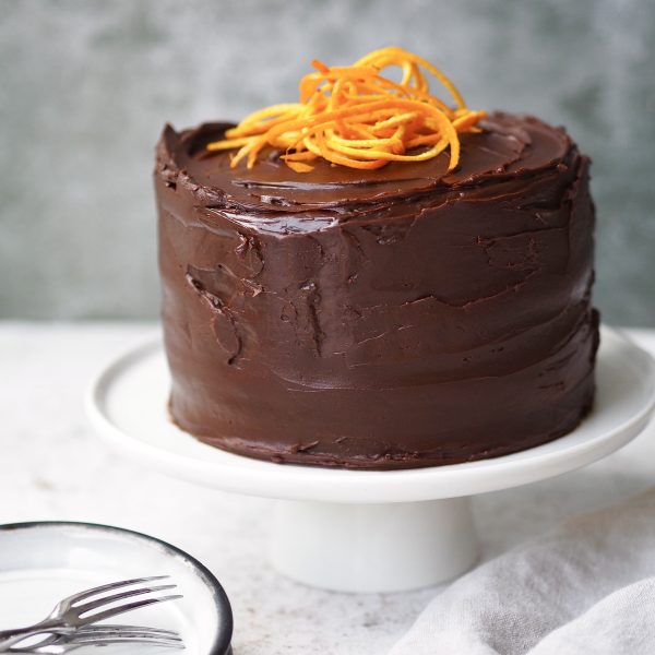 jaffa cake cake on a white cake stand