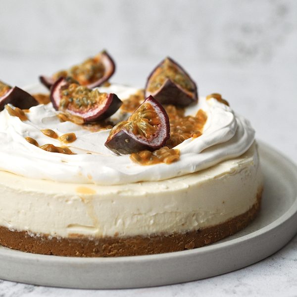 White Chocolate and Passion Fruit Cheesecake on a white plate