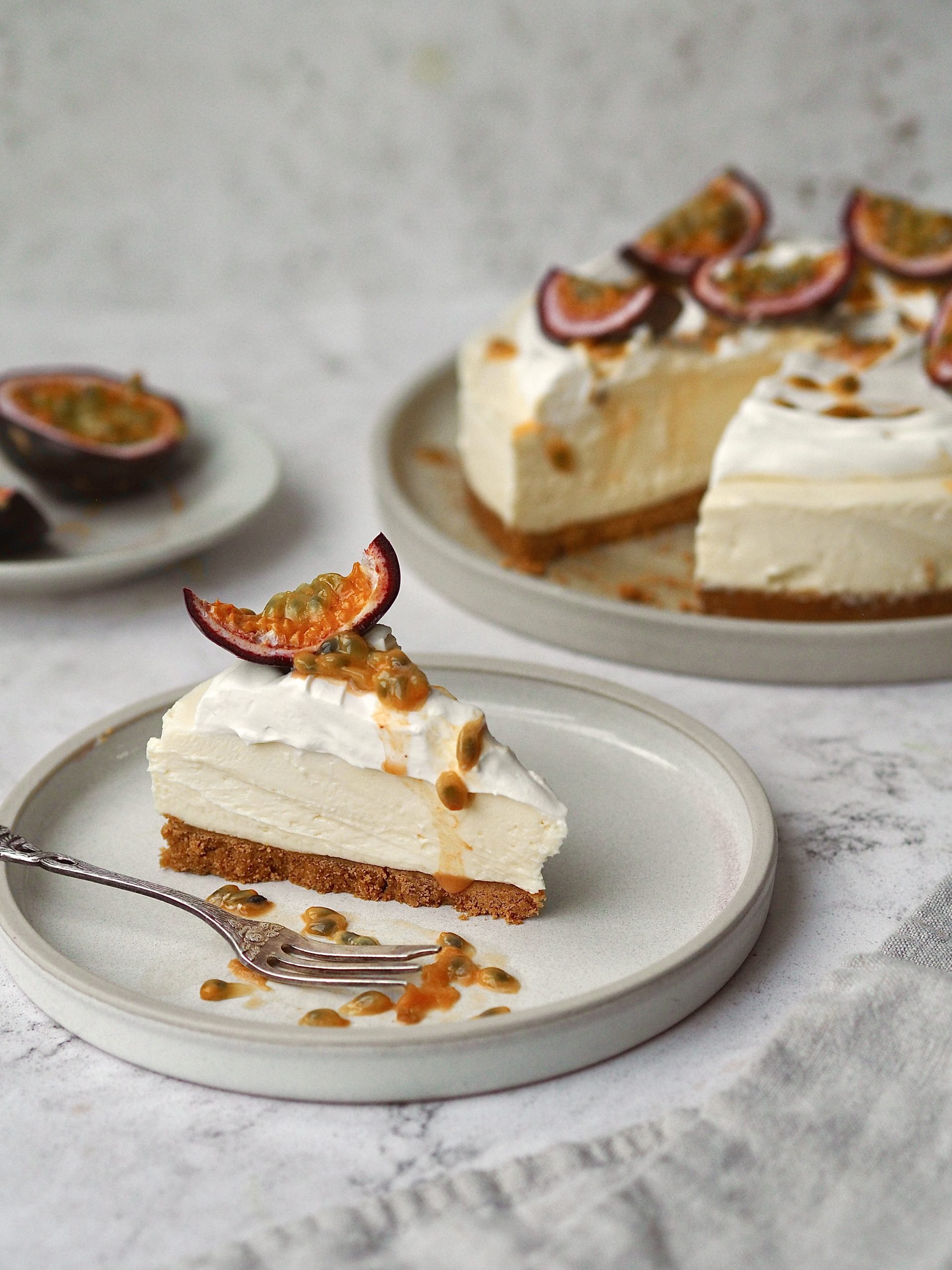 White Chocolate and Passion Fruit Cheesecake on a white plate in slices