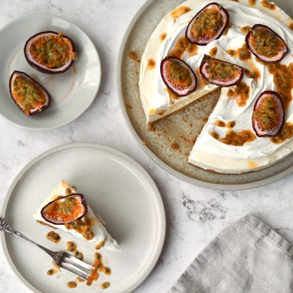 White Chocolate and Passion Fruit Cheesecake on a white plate in slices