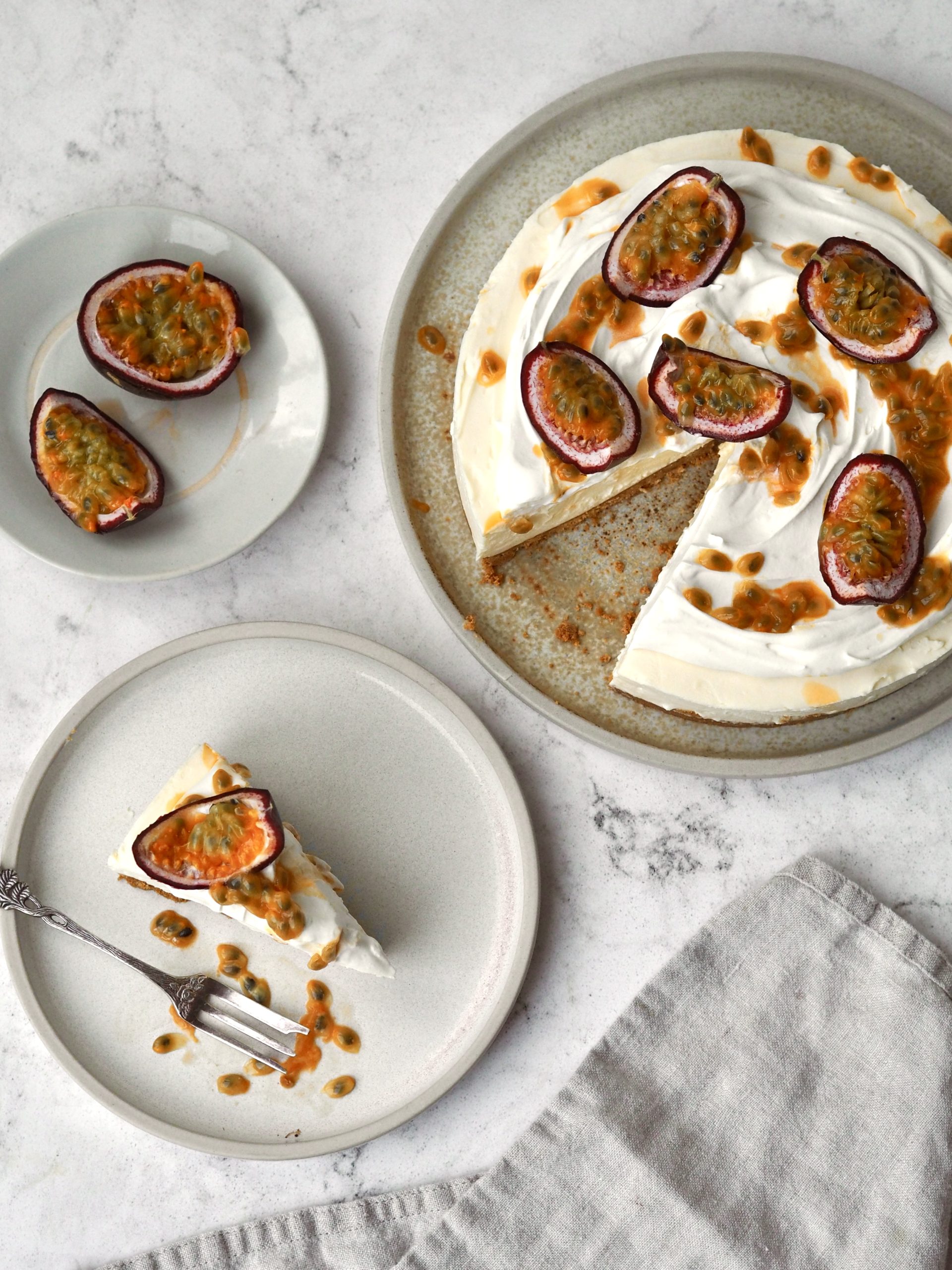 White Chocolate and Passion Fruit Cheesecake on a white plate in slices