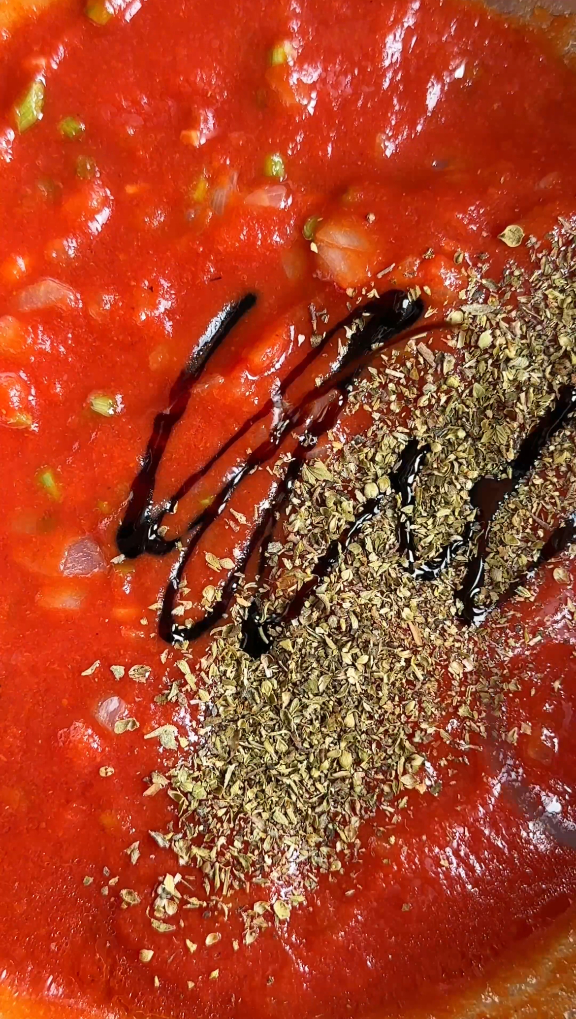 making tomato sauce for flatbread pizza