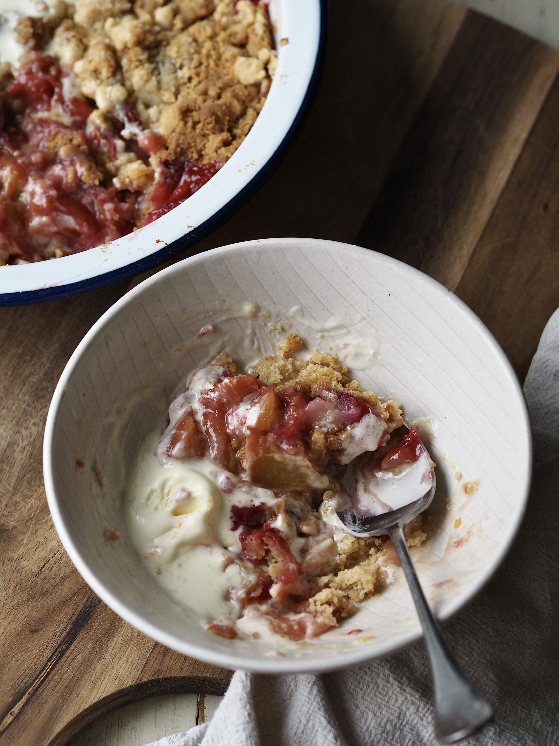 Peach Cobbler with Cake Mix in a white bowl