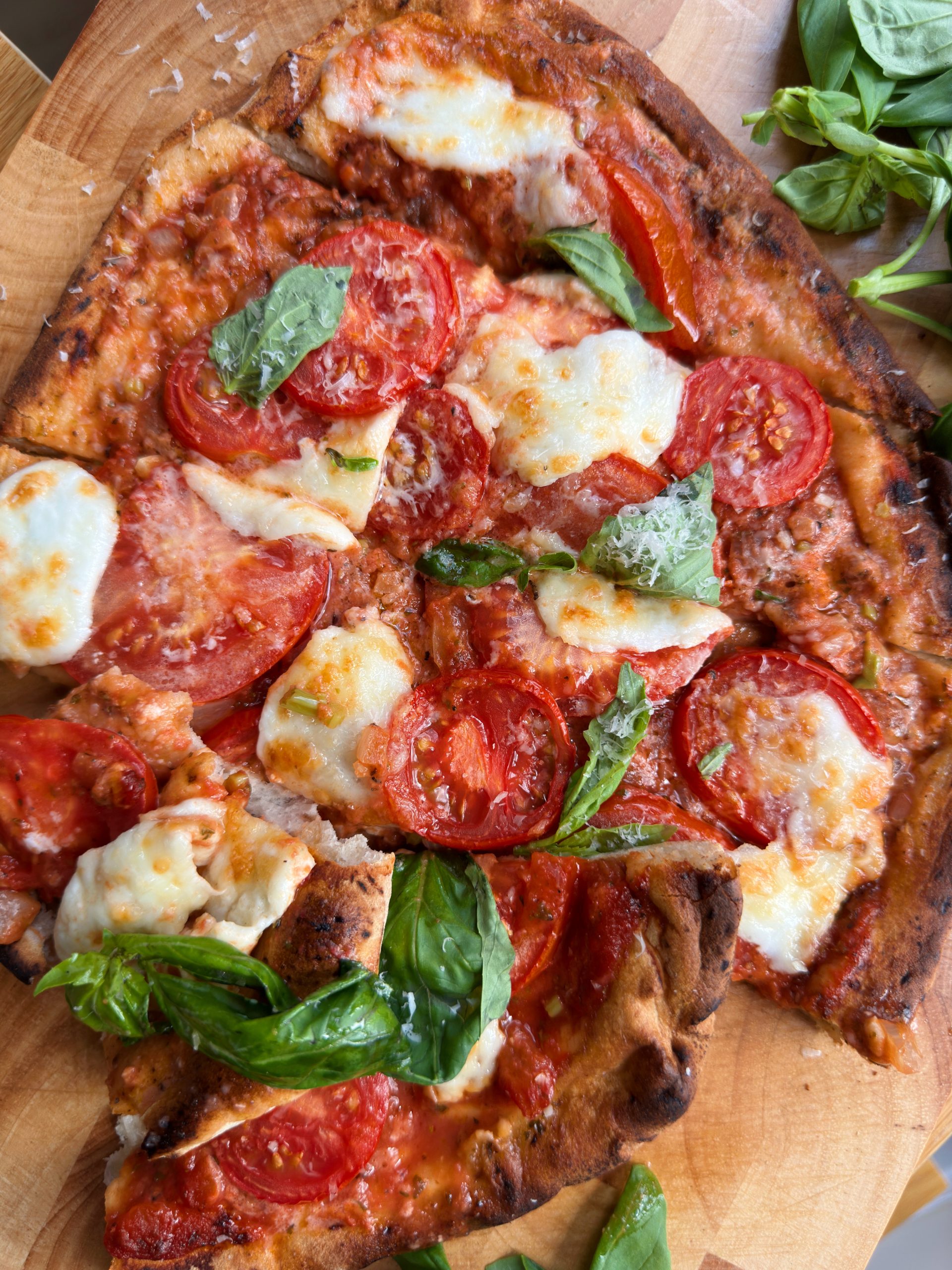 margherita pizza flatbread on a wooden board