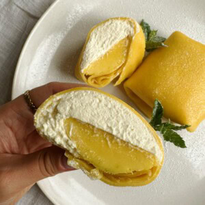 woman holding mango pancake half