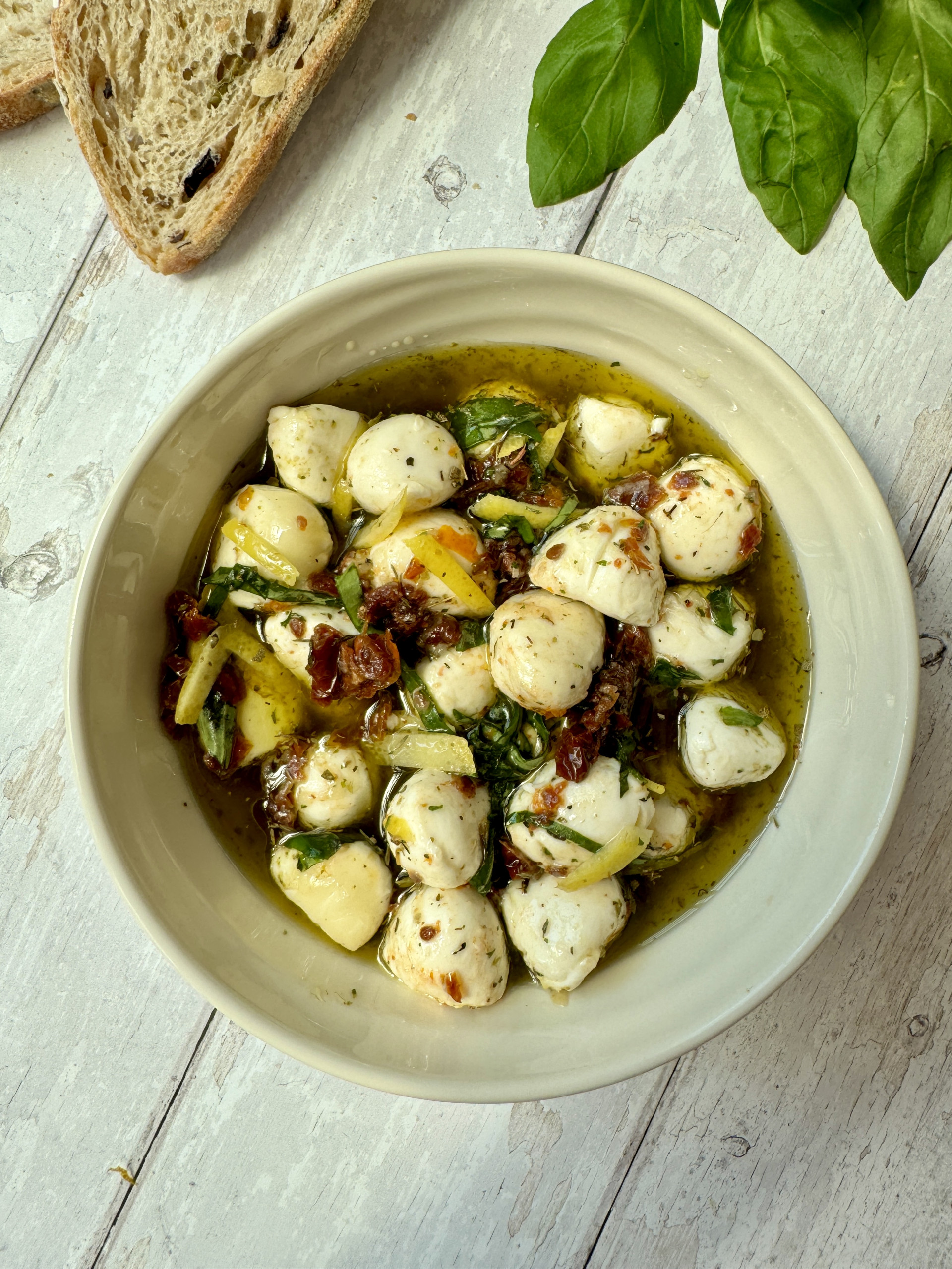 marinated mozzarella balls in a bowl