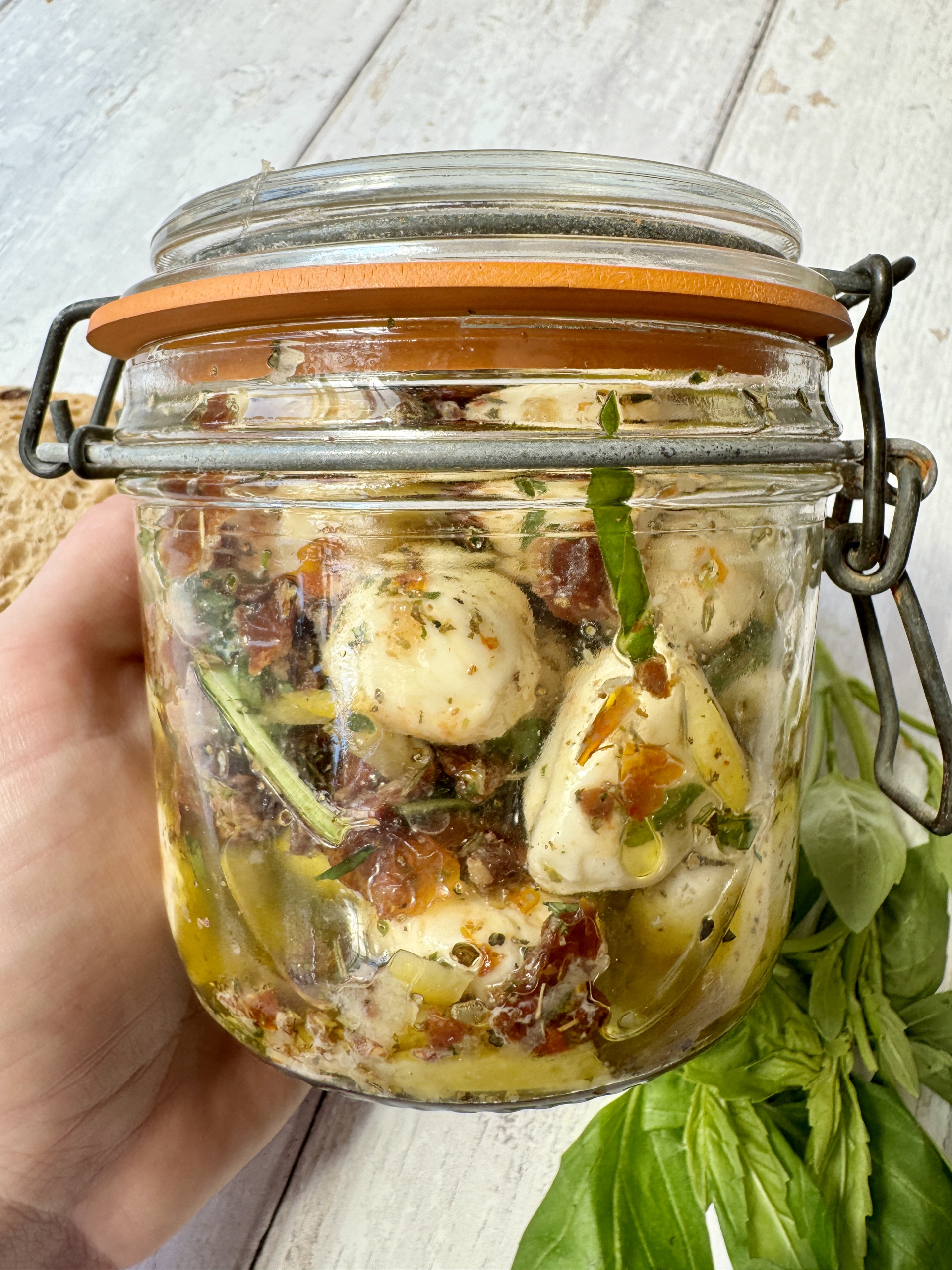 marinated mozzarella balls in a jar