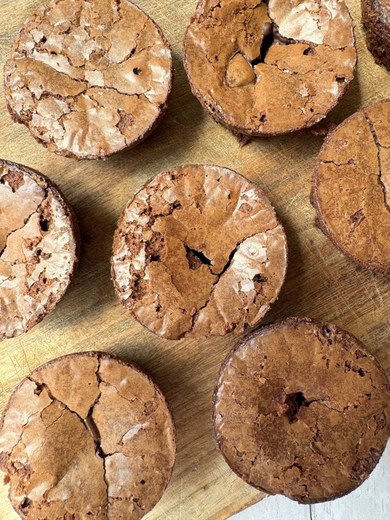 brownie bites on a wooden chopping board