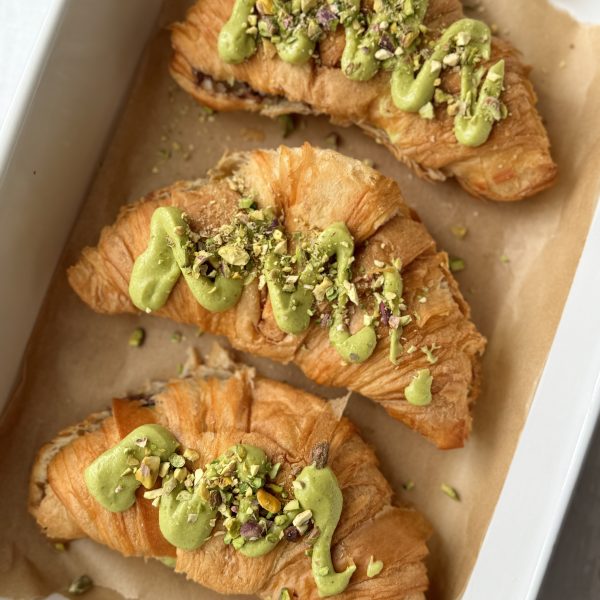 3 pistachio croissants in a baking dish