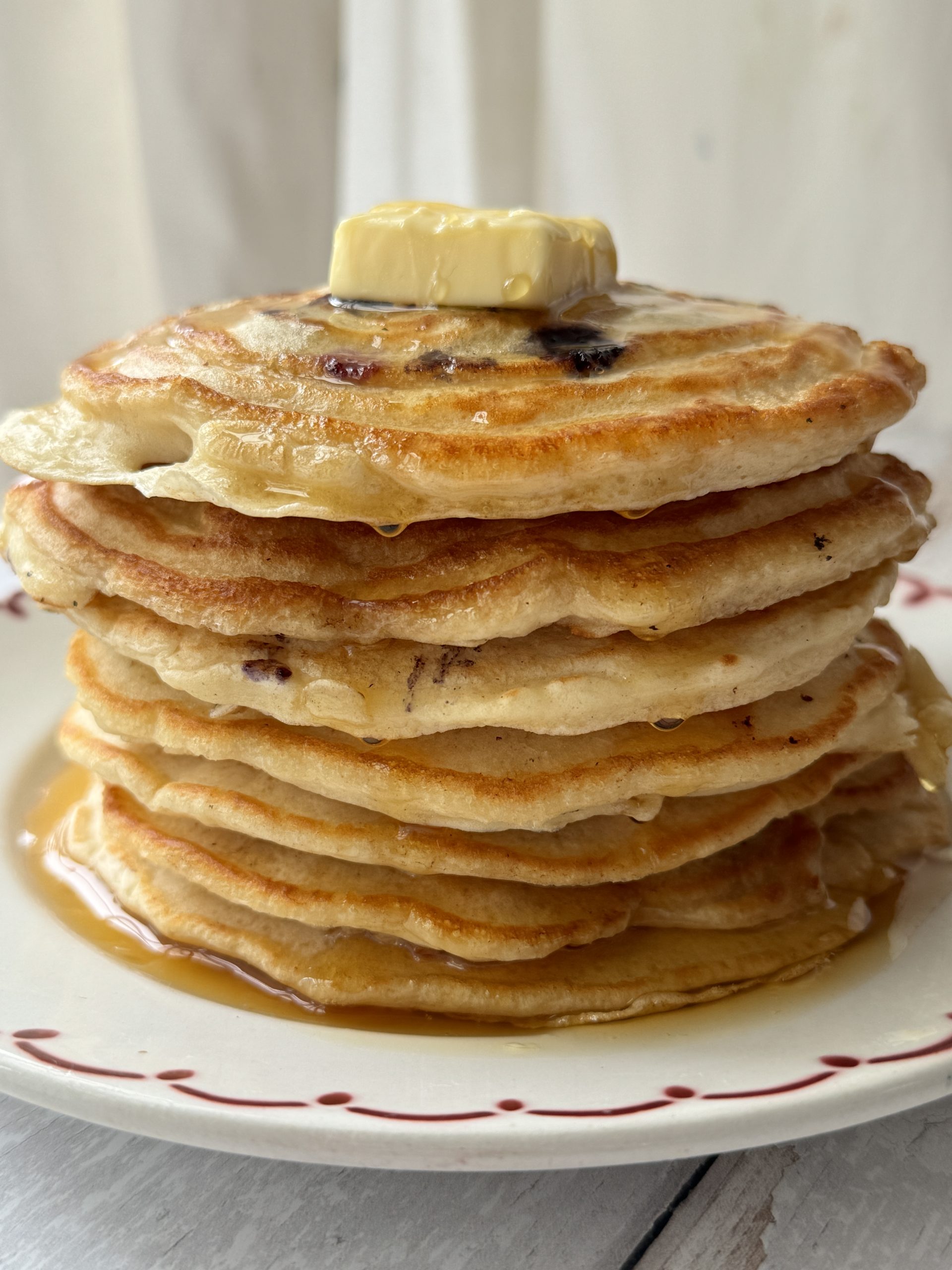 a stack of pancakes with no baking powder on a white plate