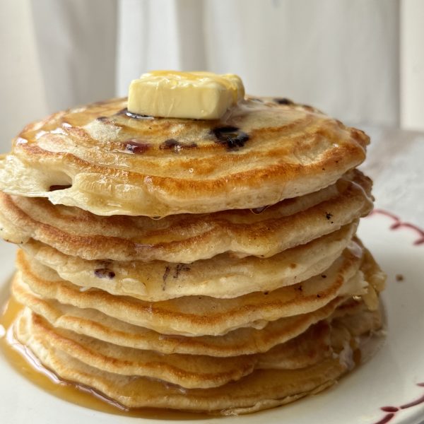 a stack of pancakes with no baking powder on a white plate