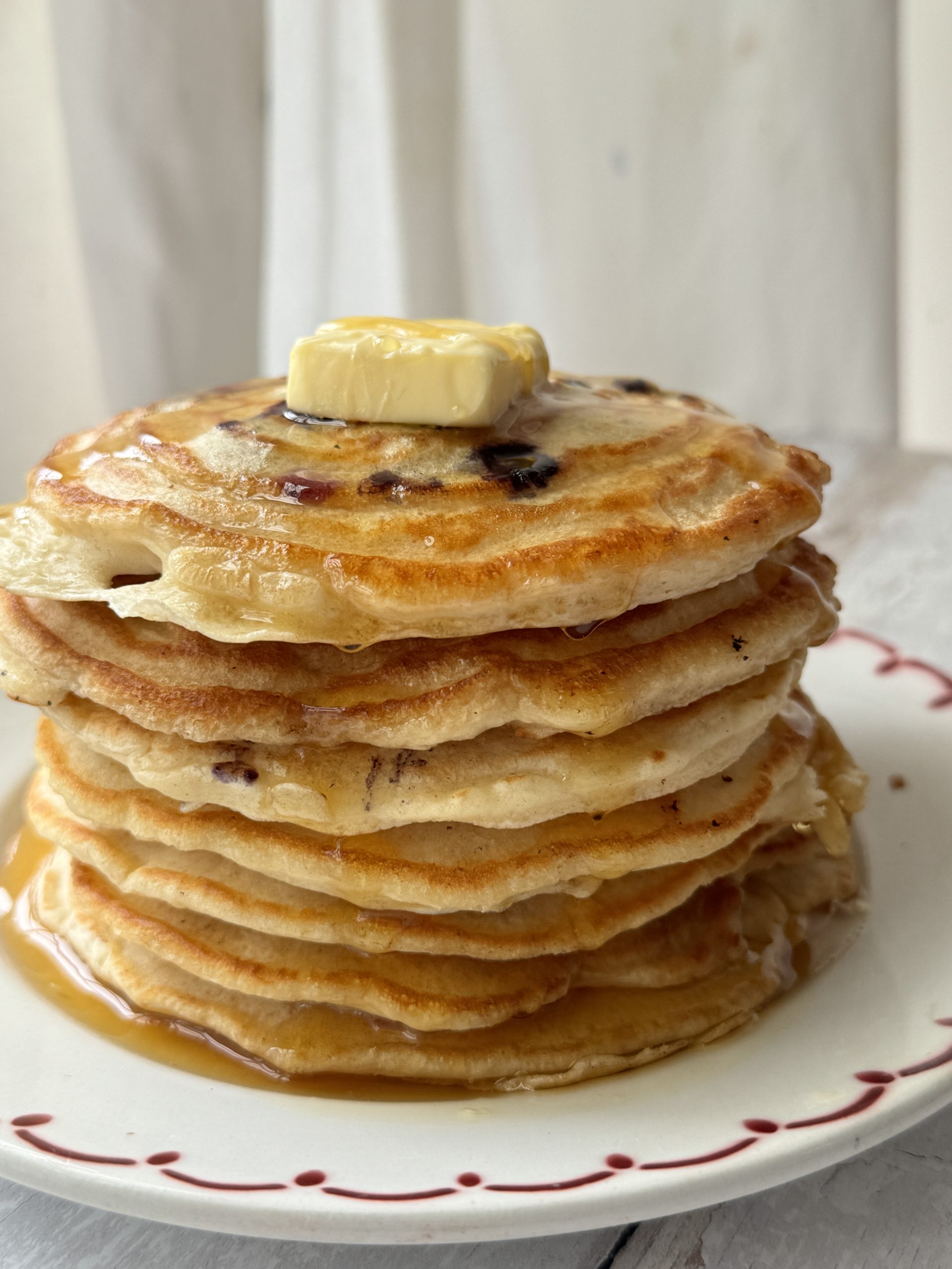 a stack of pancakes with no baking powder on a white plate