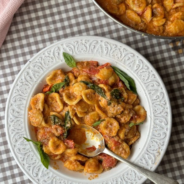 pasta con nduja in white bowl