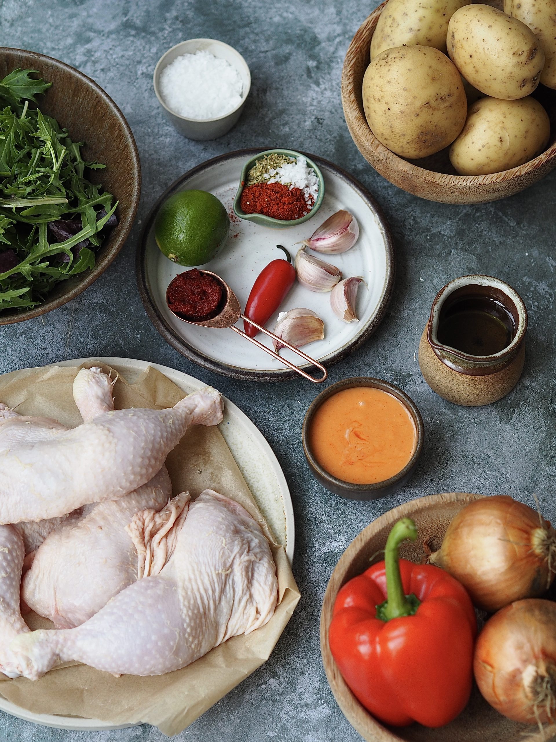 Measured out ingredients to make peri peri chicken, potato wedges and sriracha mayonnaise. 