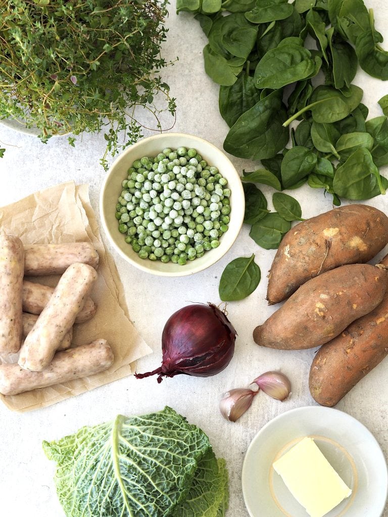 Ingredients to make sausage and sweet potato mash with greens and garlic thyme butter.