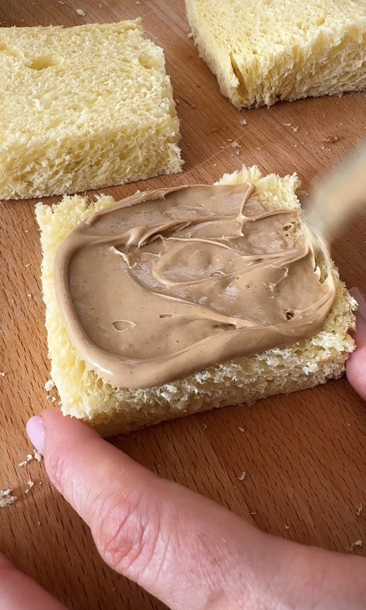 spreading french toast with hazelnut creme.