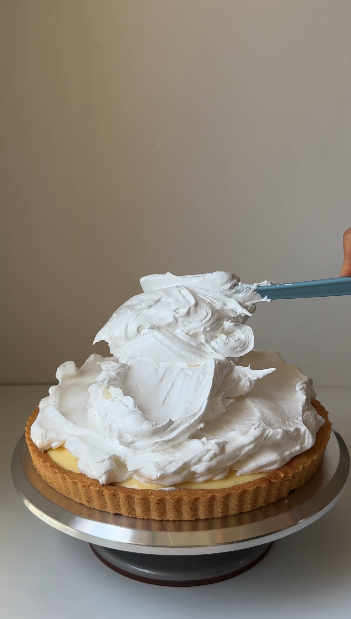 adding meringue on top of tart