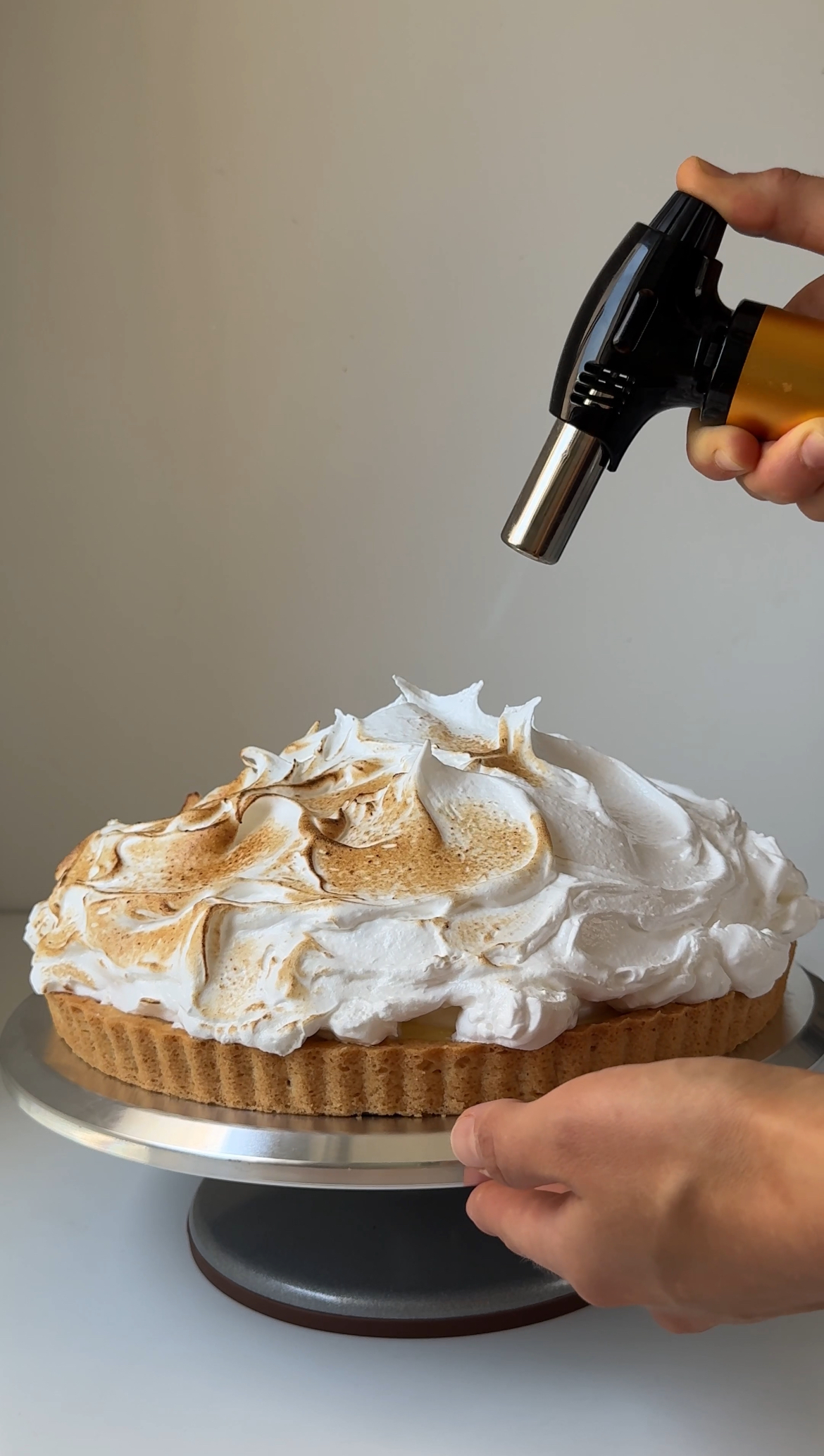 blowtorching lemon meringue tart