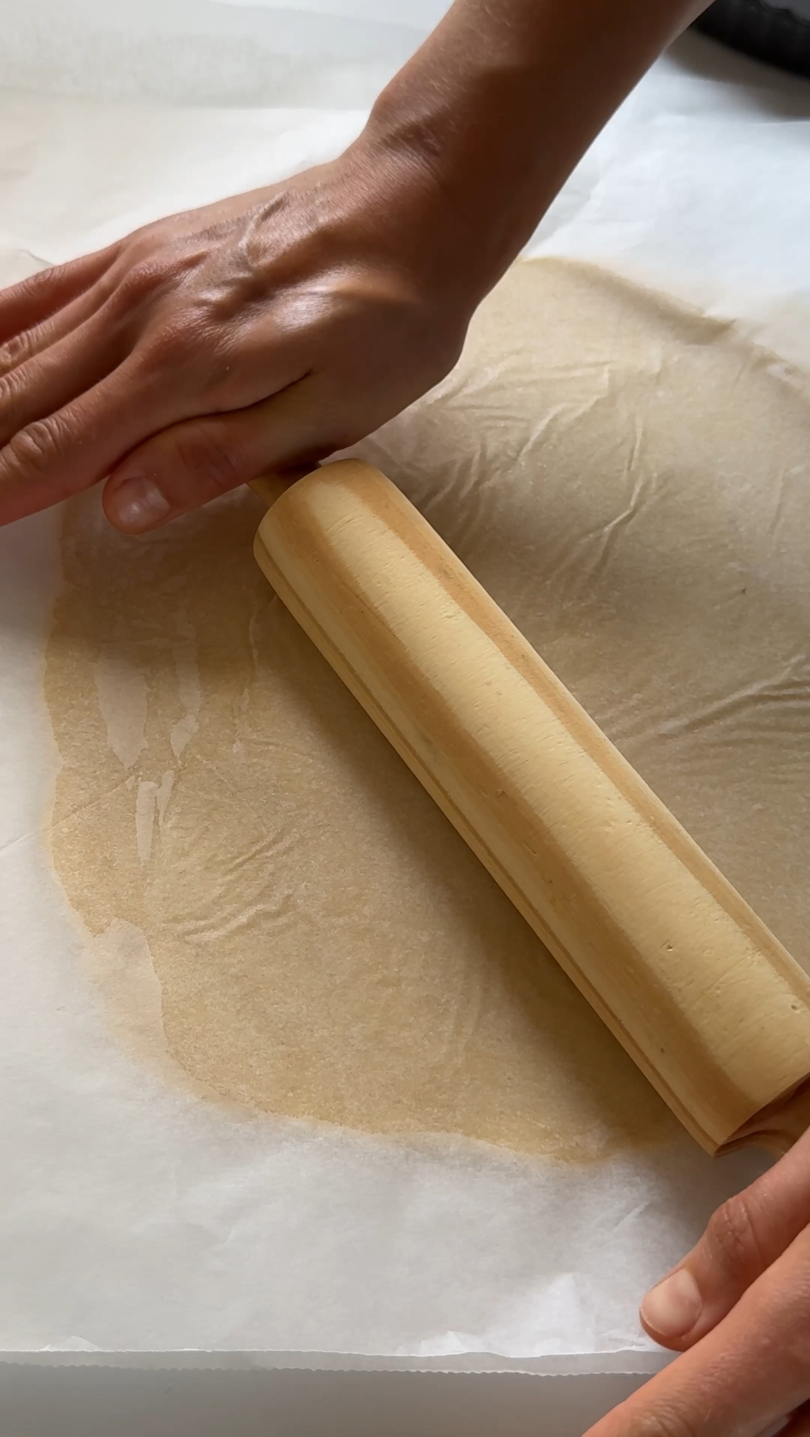 laying pastry into pie tin