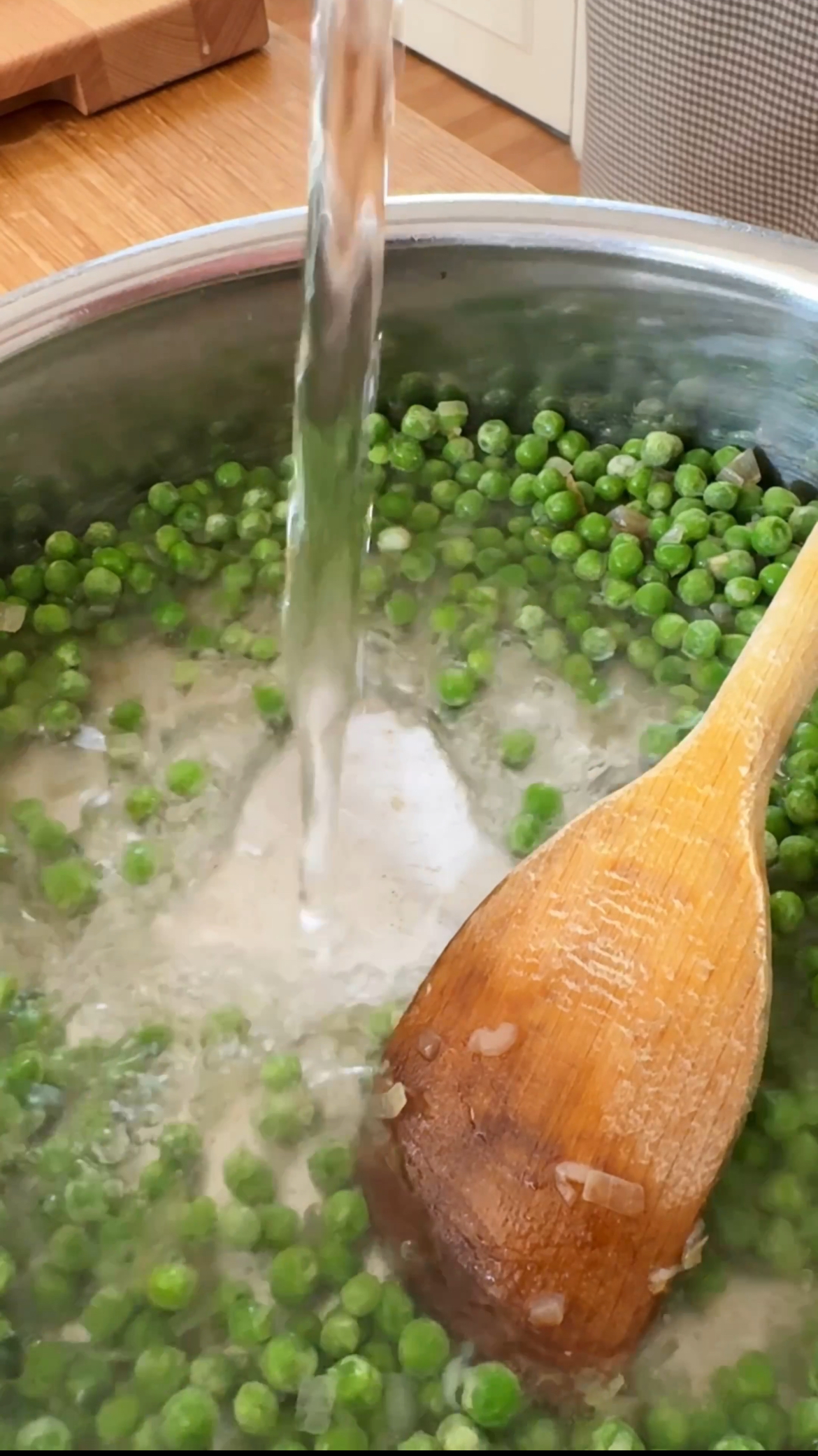 adding water to the peas