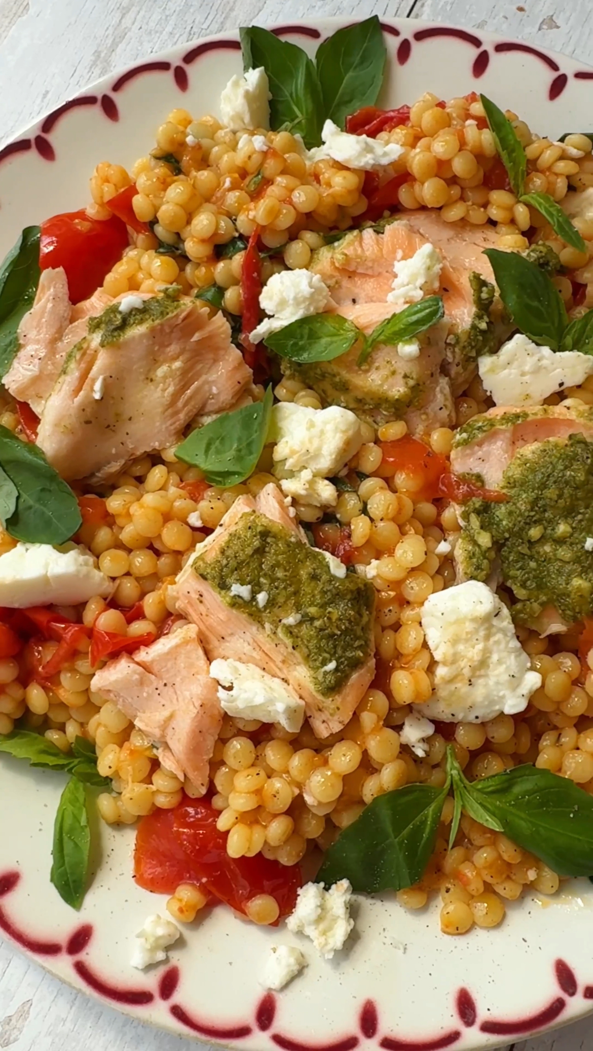 salmon with pesto crust and roasted tomato giant couscous salad