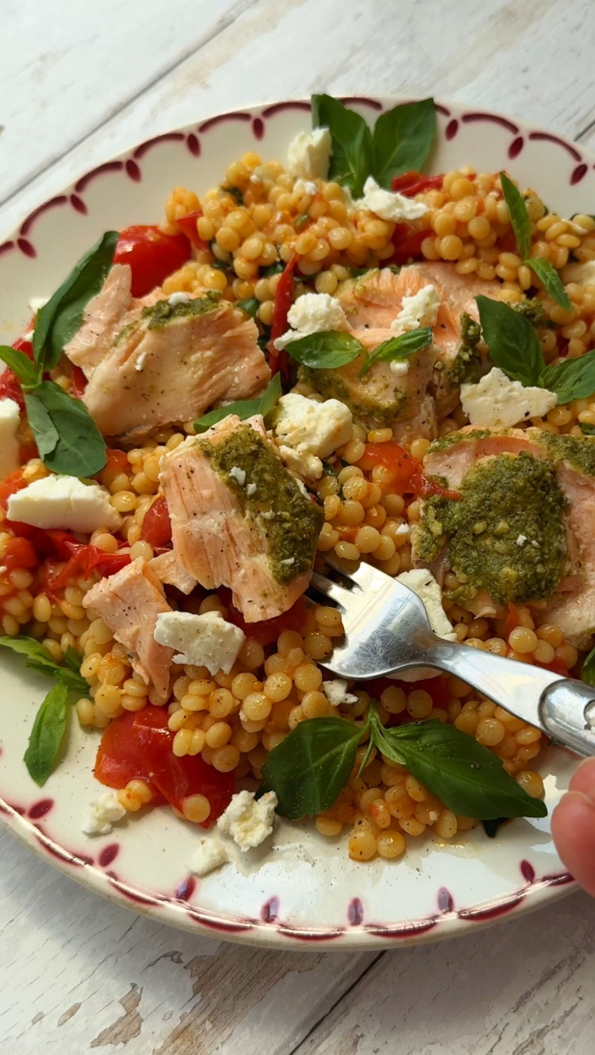 salmon with pesto crust and roasted tomato giant couscous salad