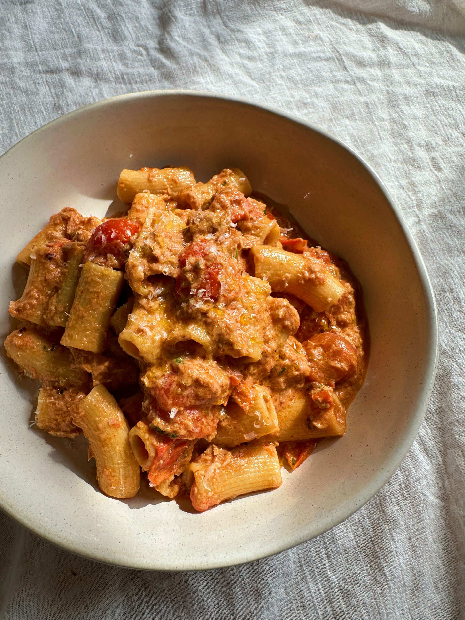 spicy tuna pasta in a white bowl