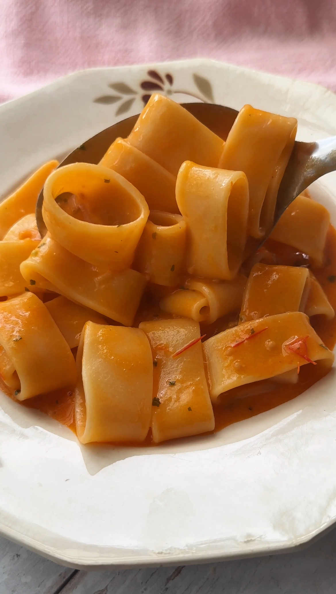 serving tomato butter pasta in bowls