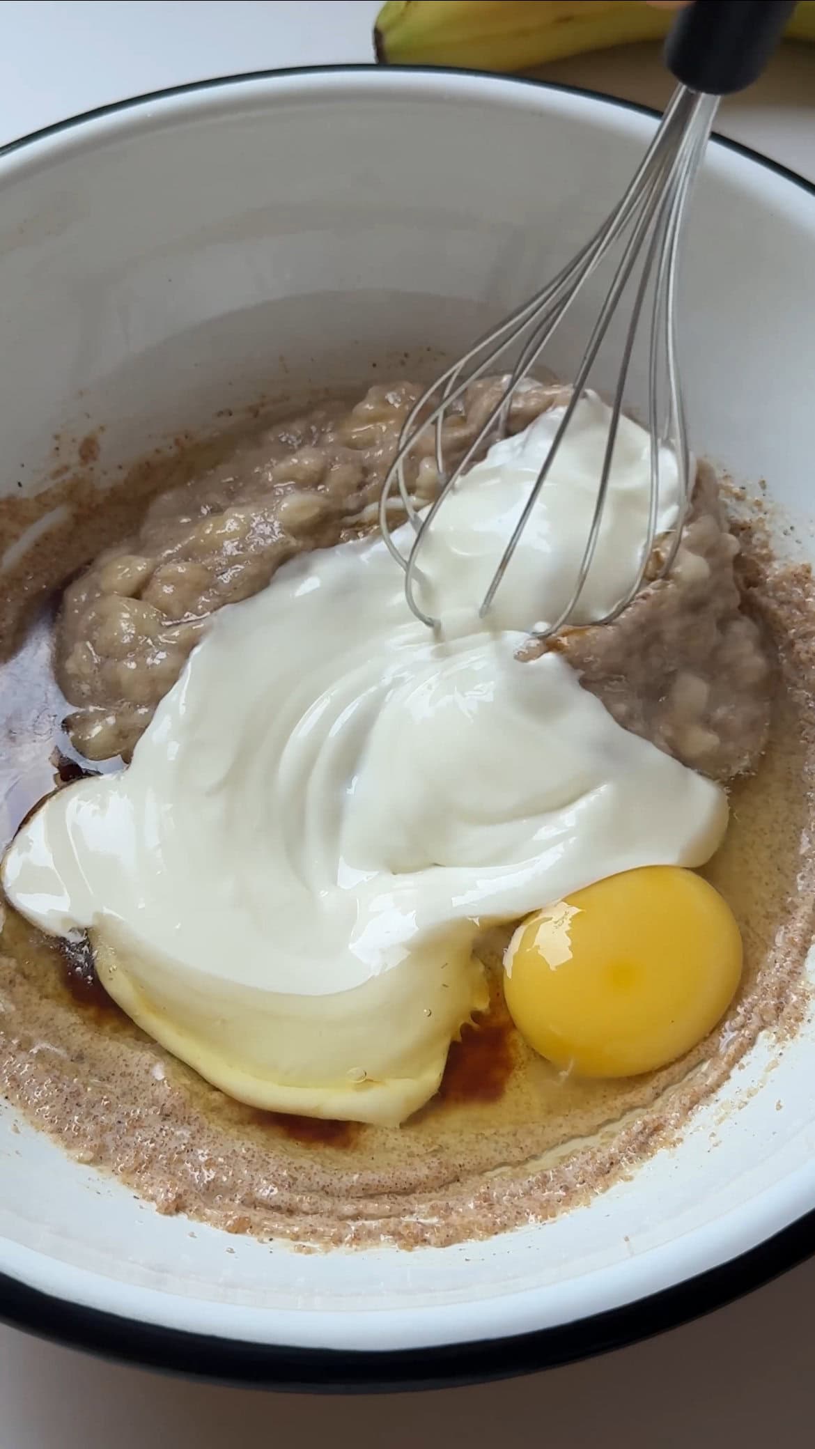 adding yoghurt to the batter.