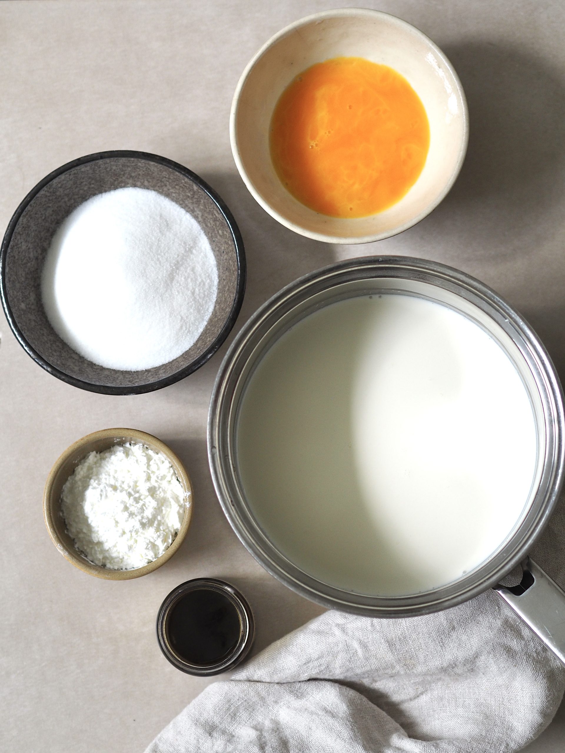 Vanilla custard ingredients measured into bowls.