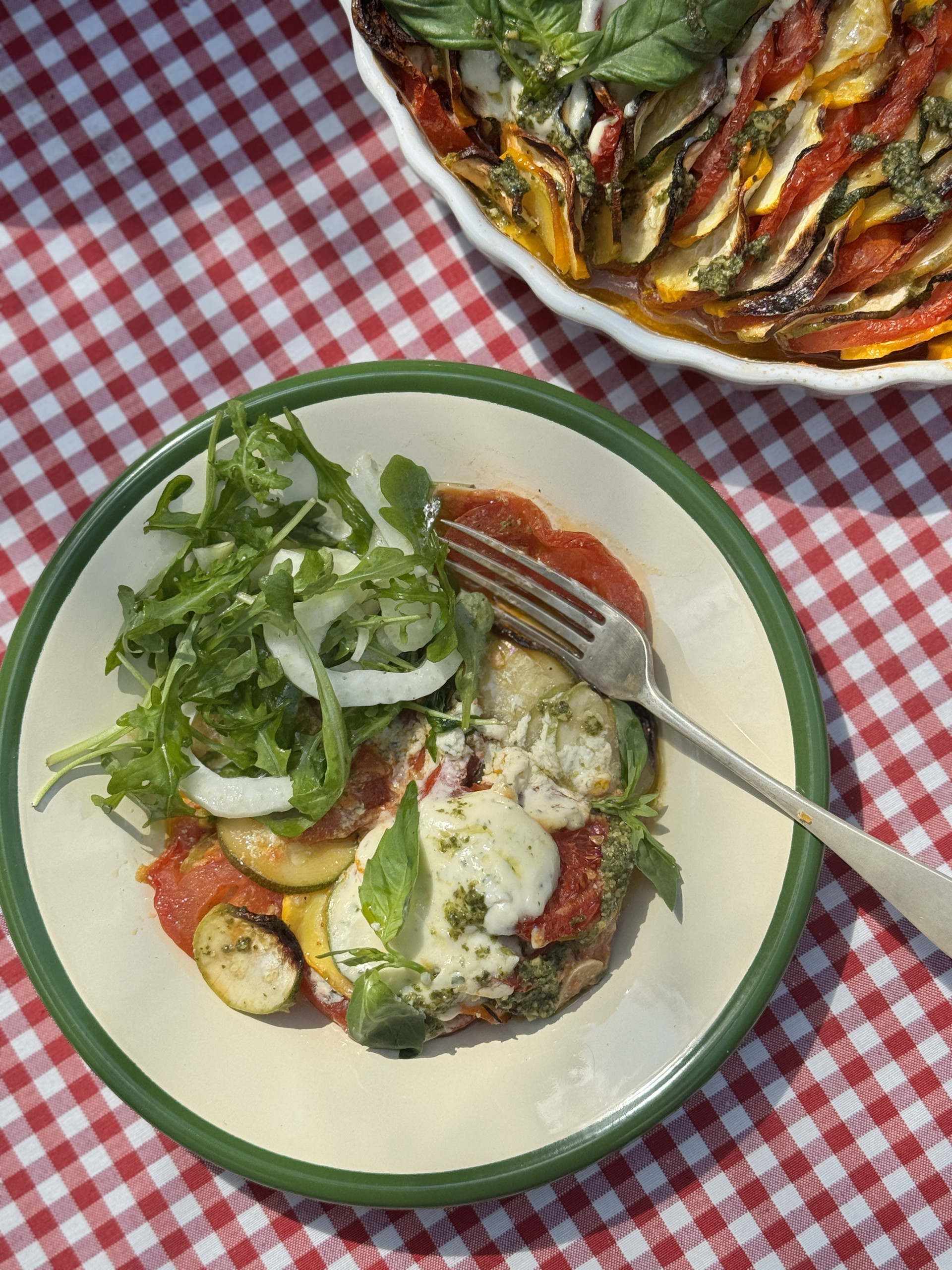 courgette gratin on a plate with salad.