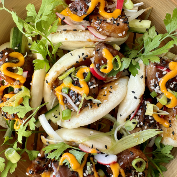 plate of duck bao buns.