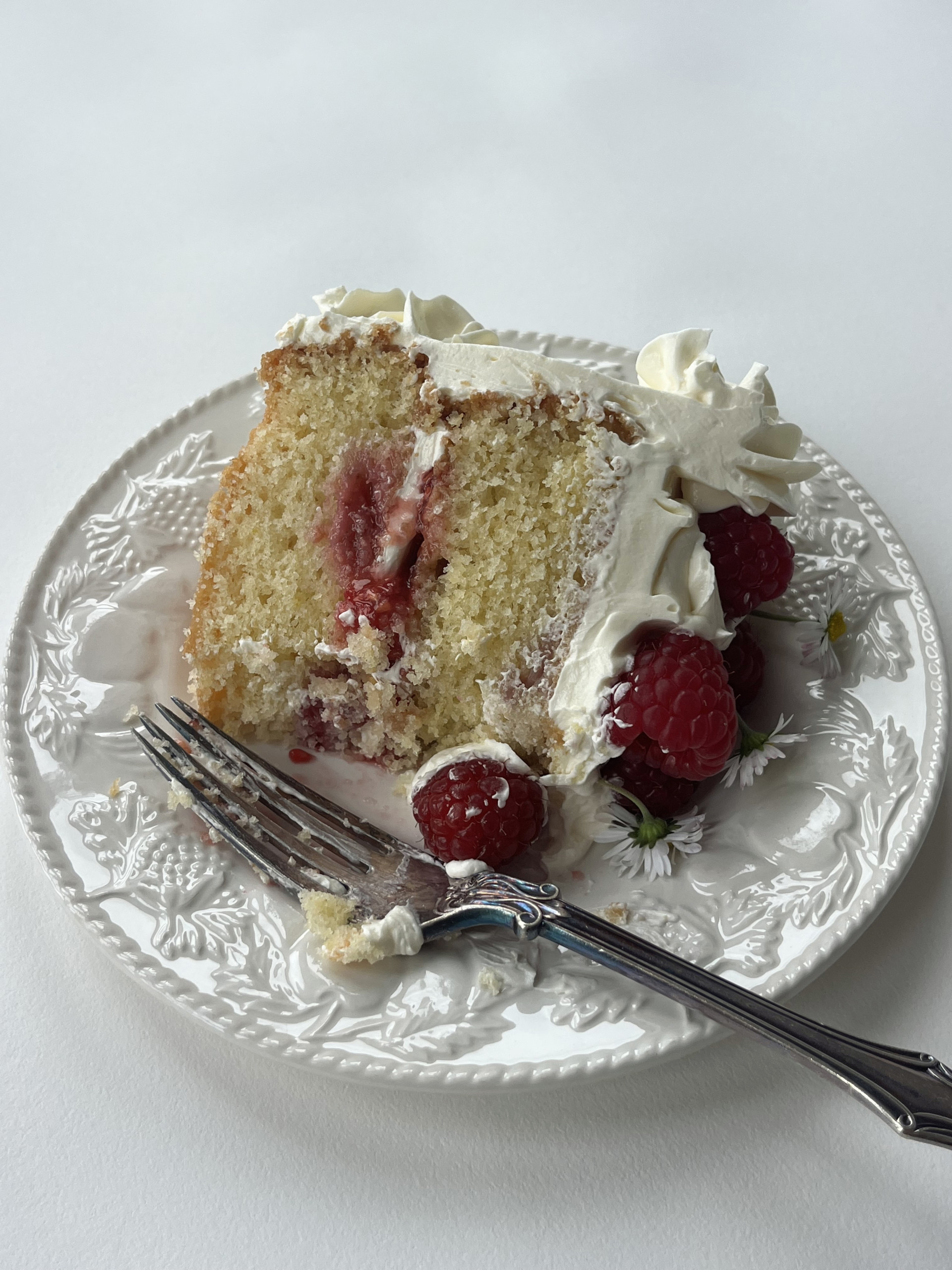 slice of white chocolate and raspberry cake.