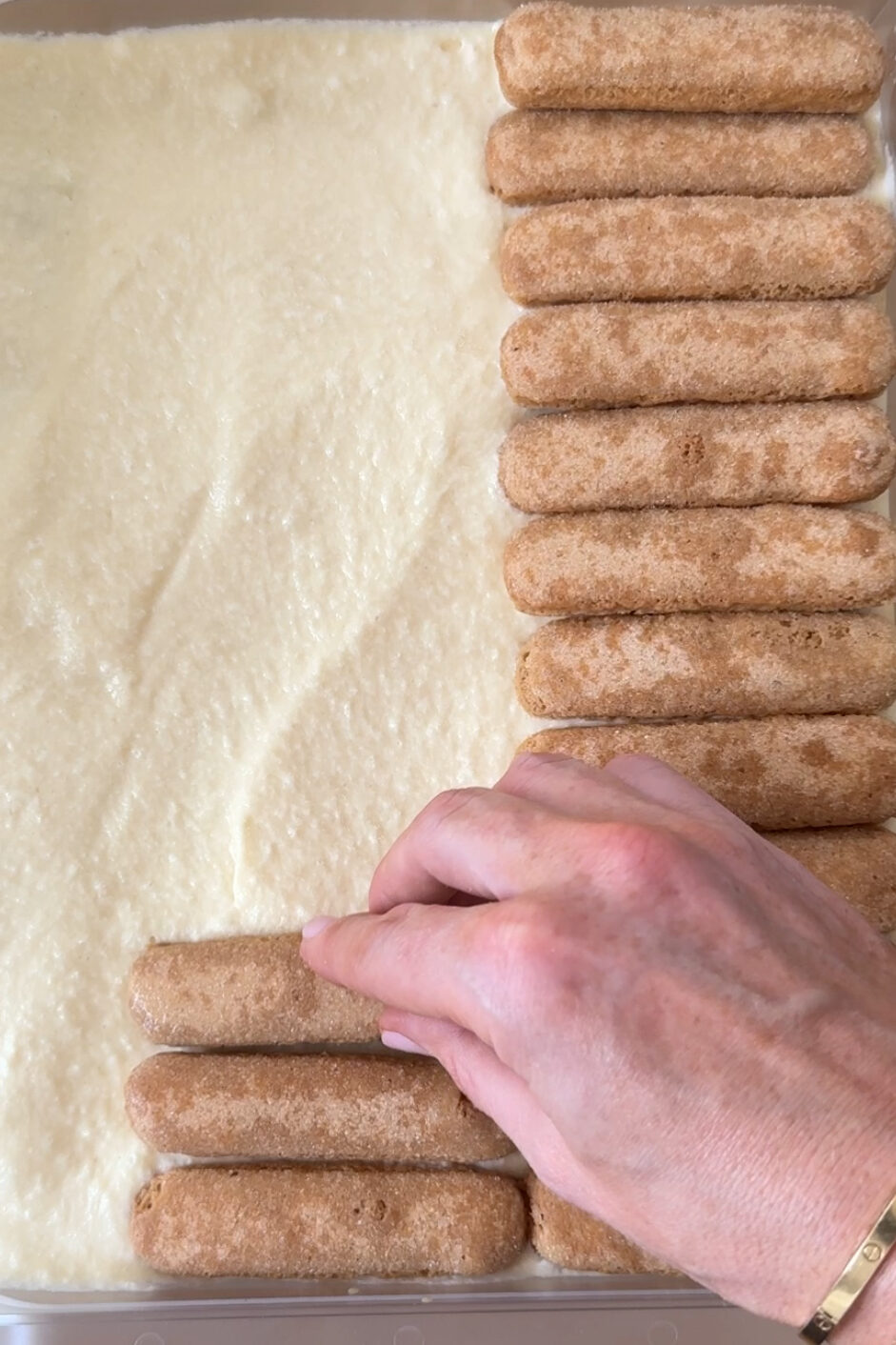 add soaked lady fingers to tiramisu