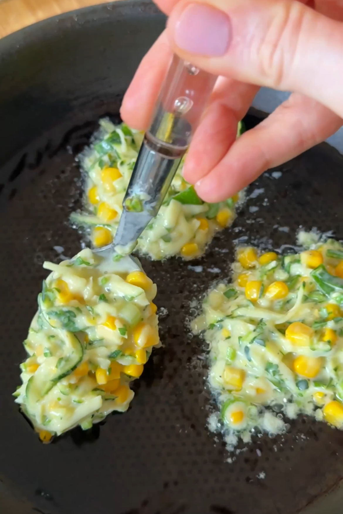 frying courgette and corn fritters