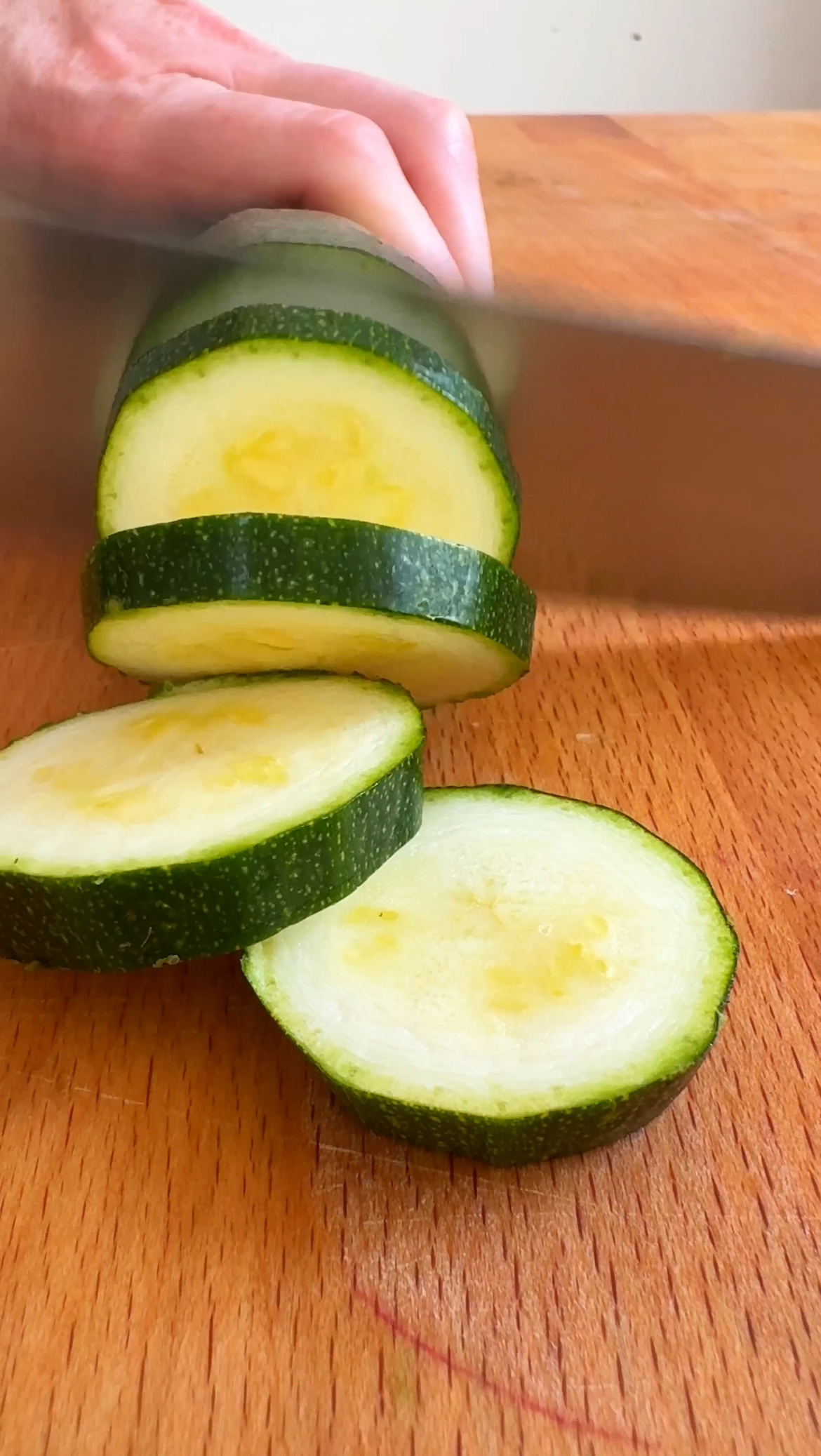 cutting zucchini slices