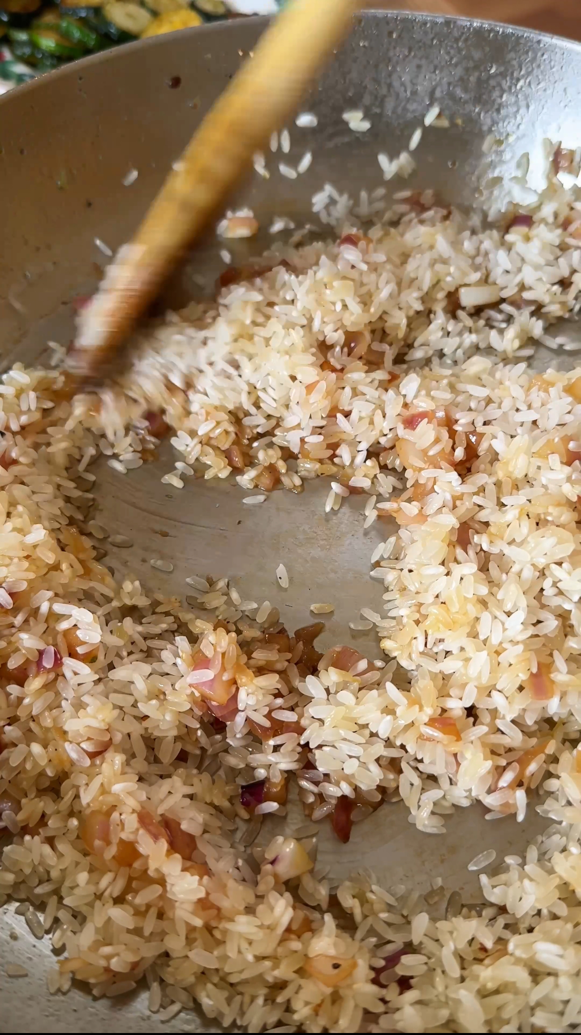 adding risotto rice