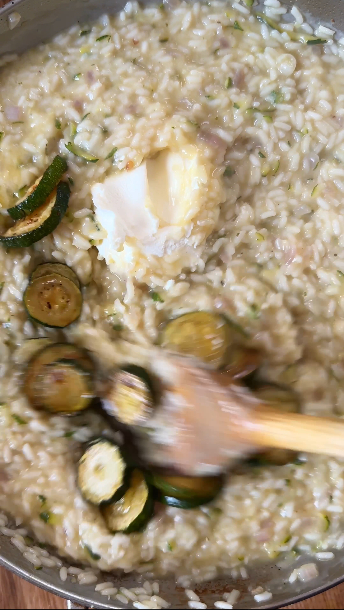 stirring in mascarpone to risotto