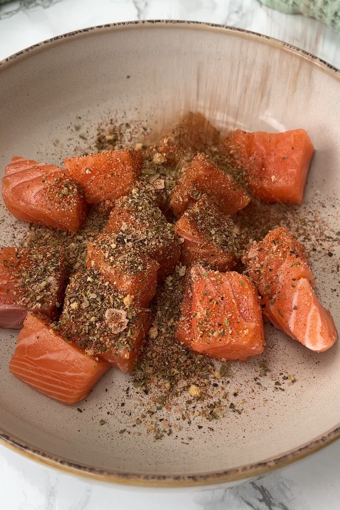 seasoning the spicy salmon bowl