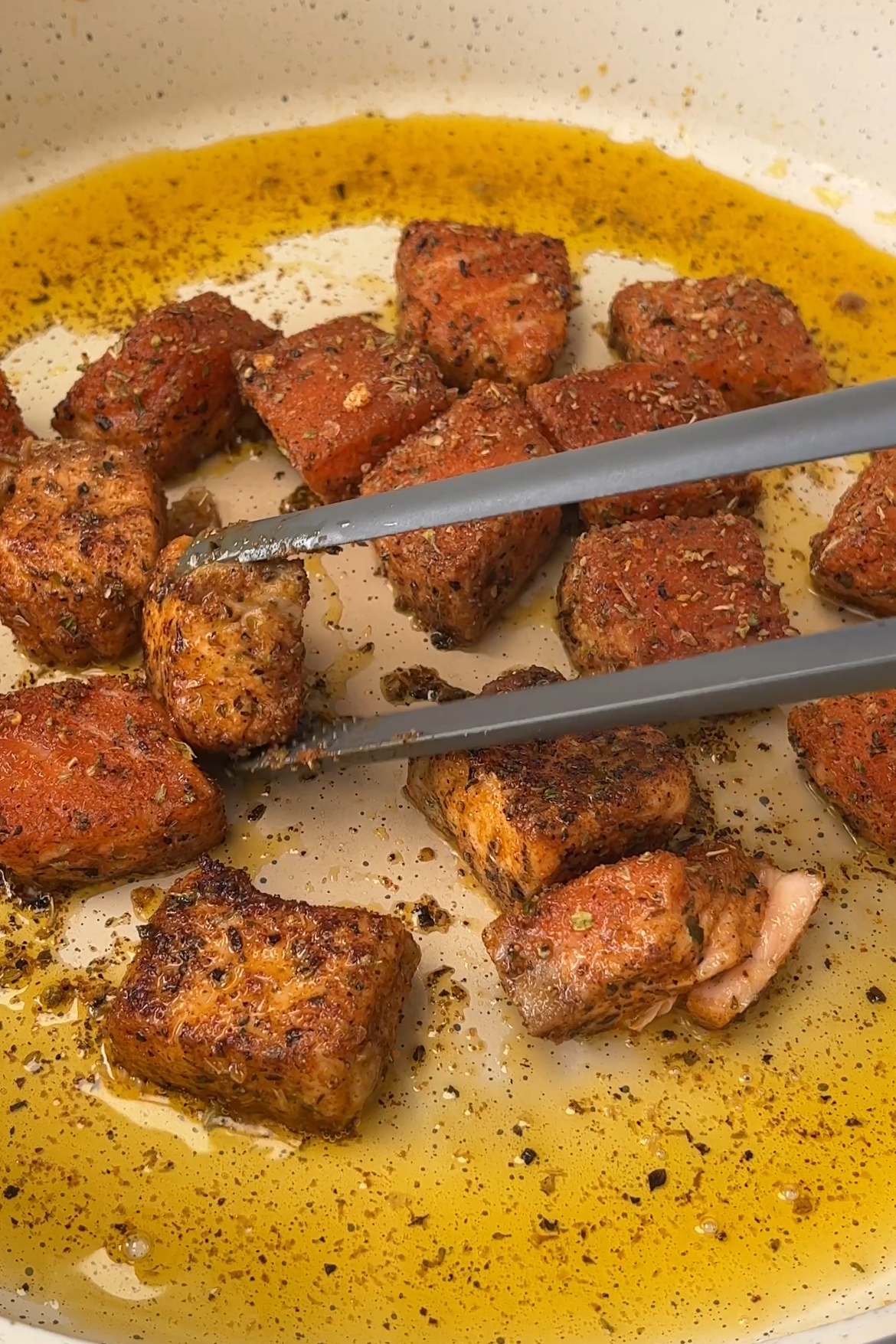 frying the spicy salmon chunks