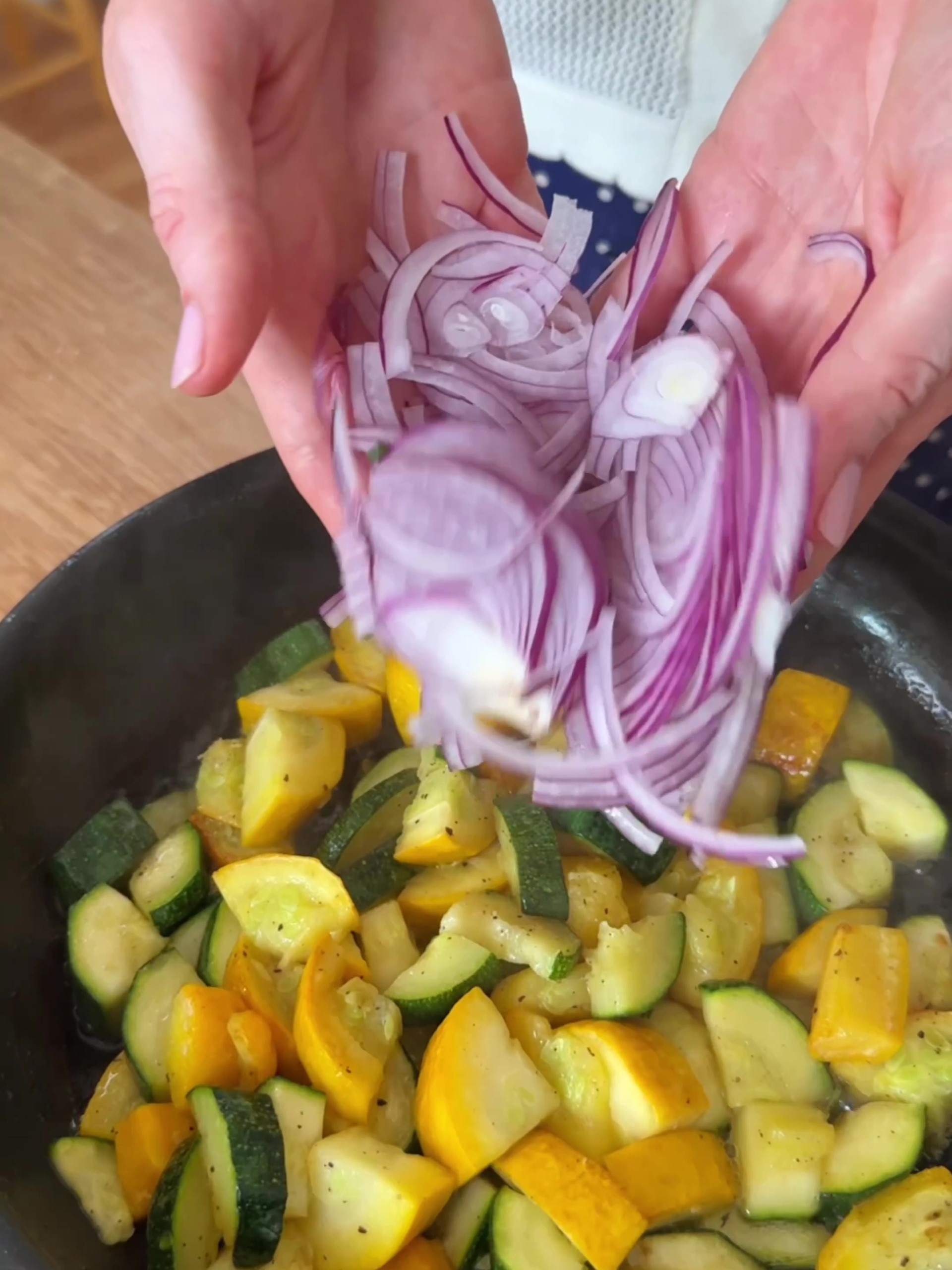 Frying courgettes in a pan