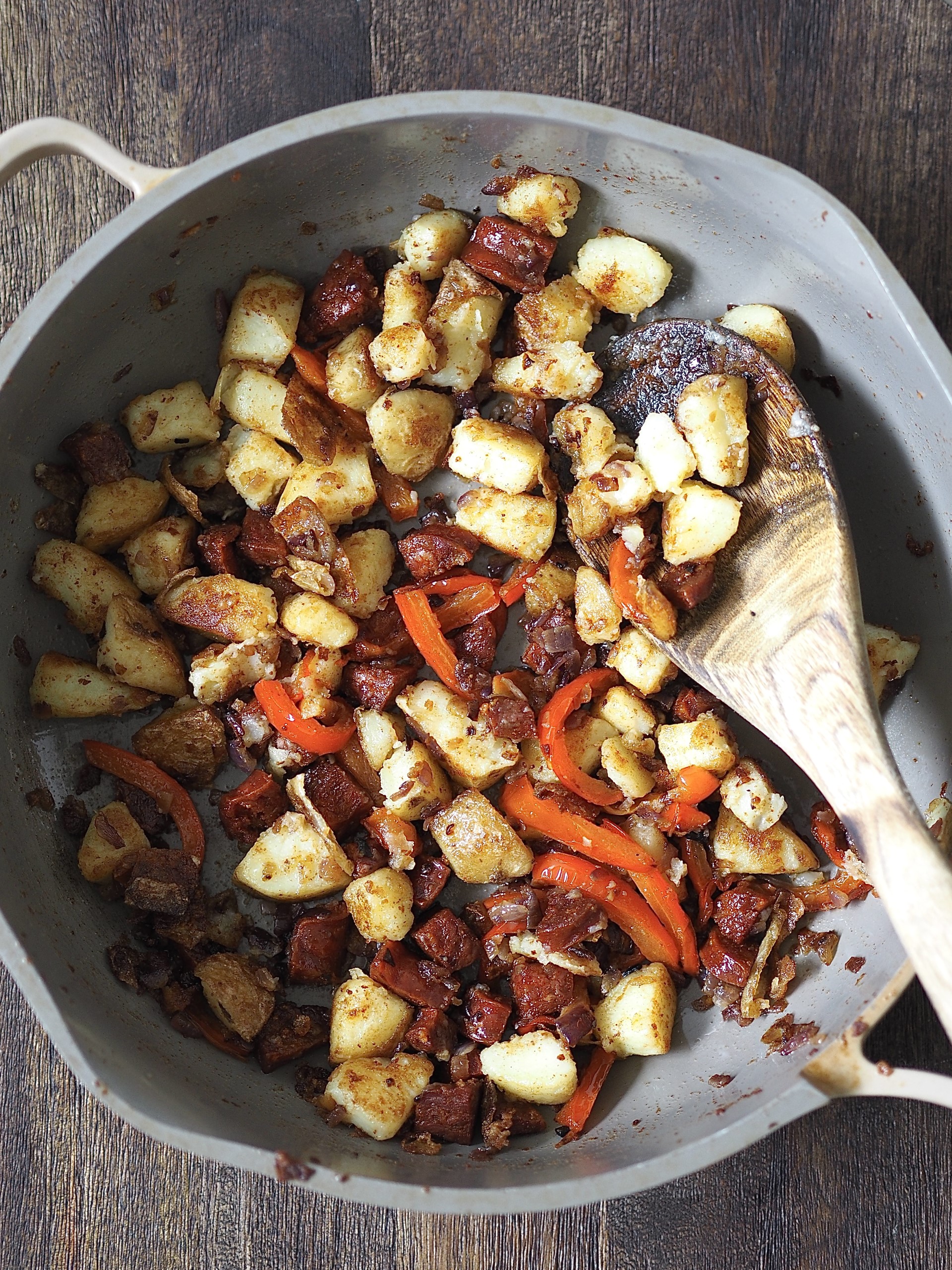 Frying onions, peppers and chorizo