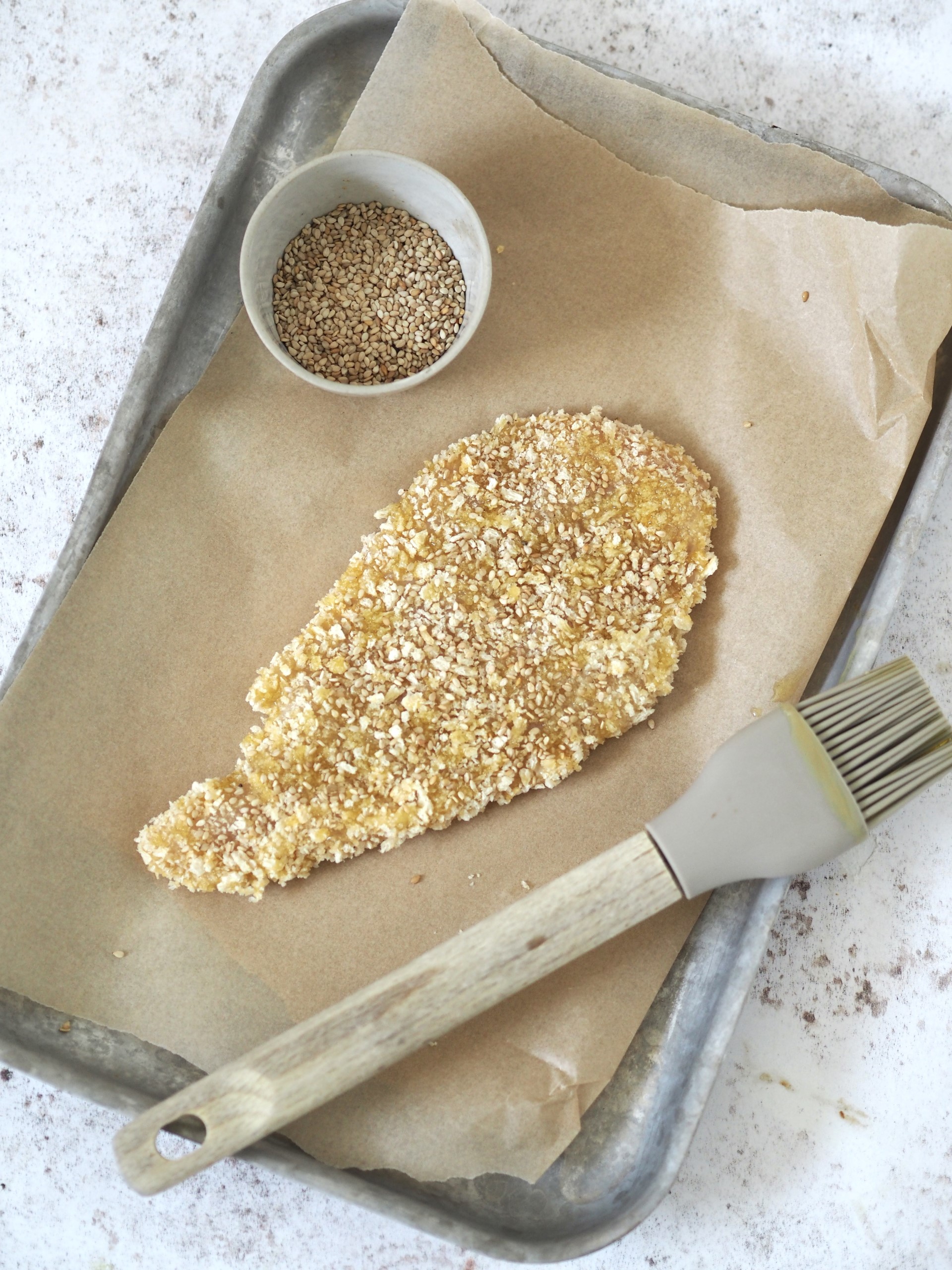 Preparing the chicken breast for Chicken Katsu Sandwich