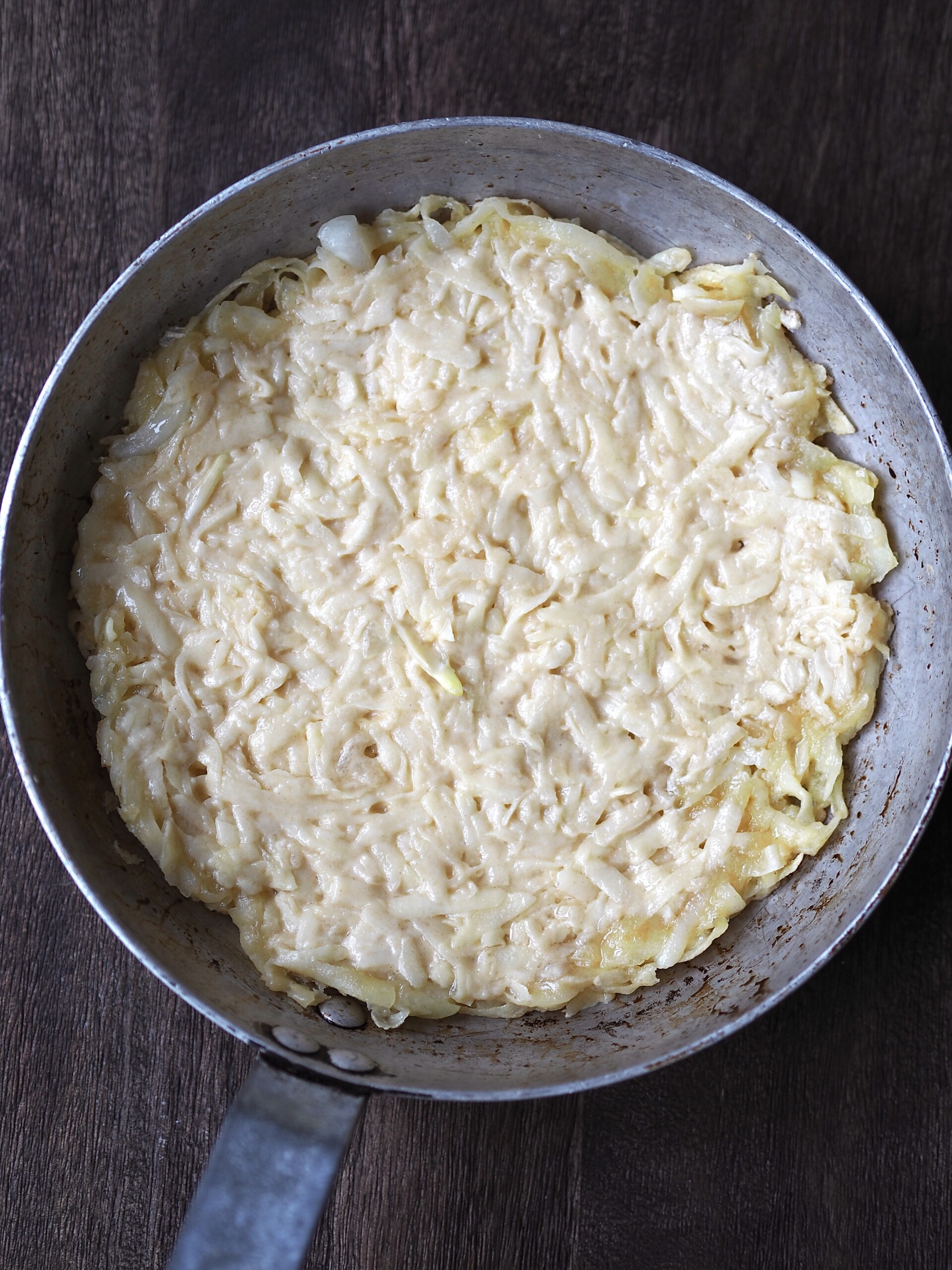 Frying the potato and onion mix.