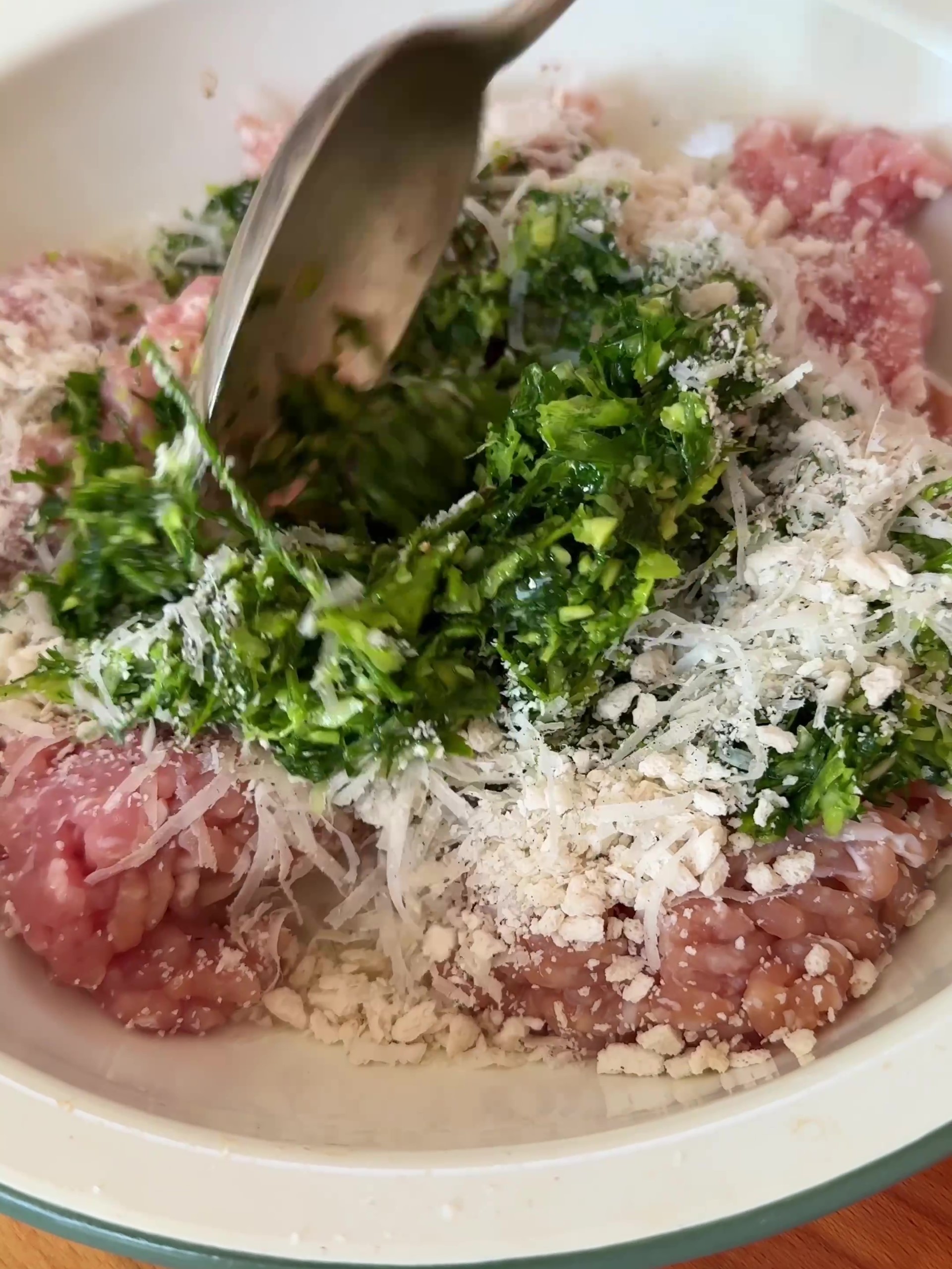 Place the chicken mince into a large bowl and add the herb mixture. Season well