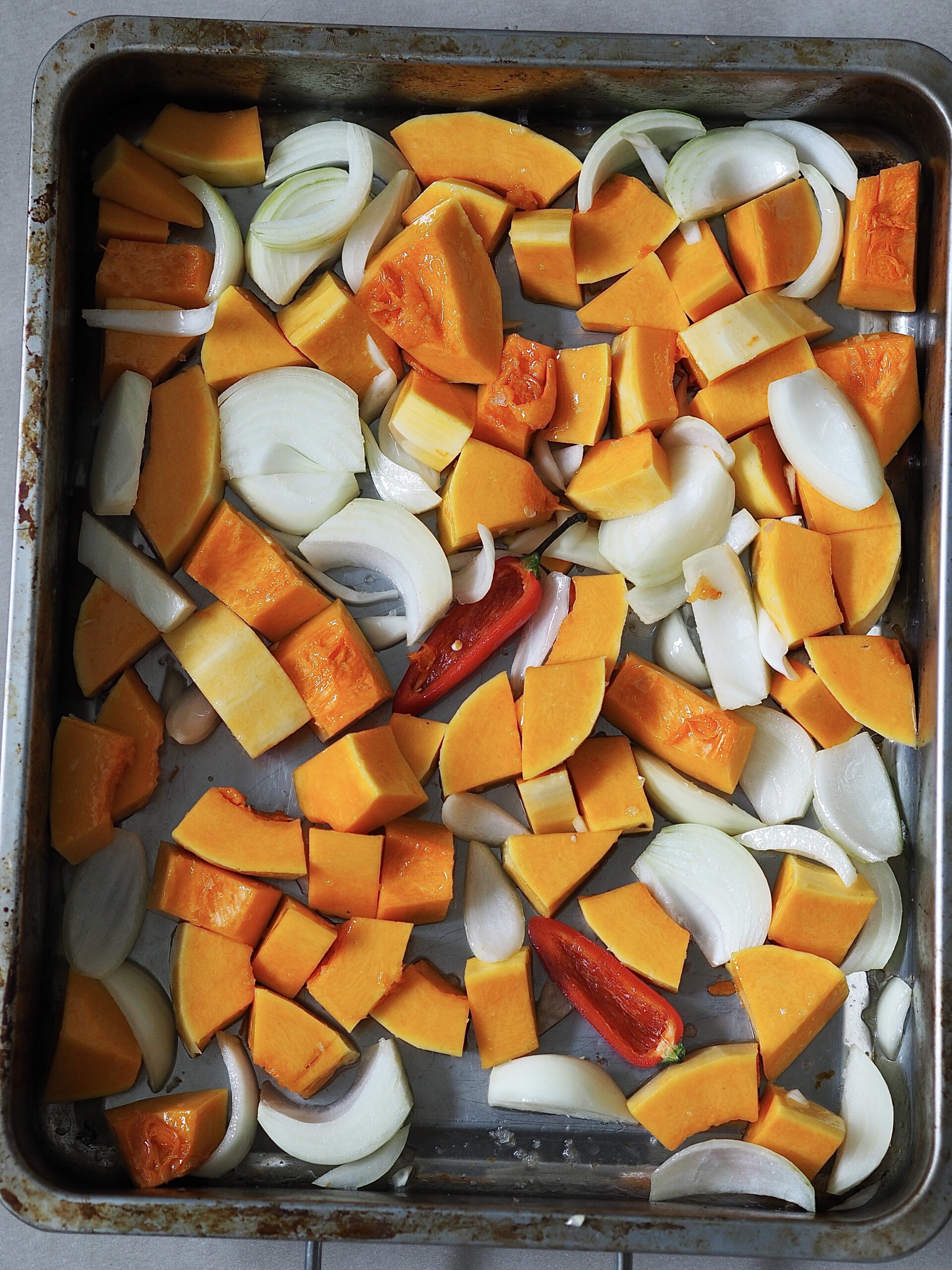 Butternut squash soup ingredients on a roasting tray.