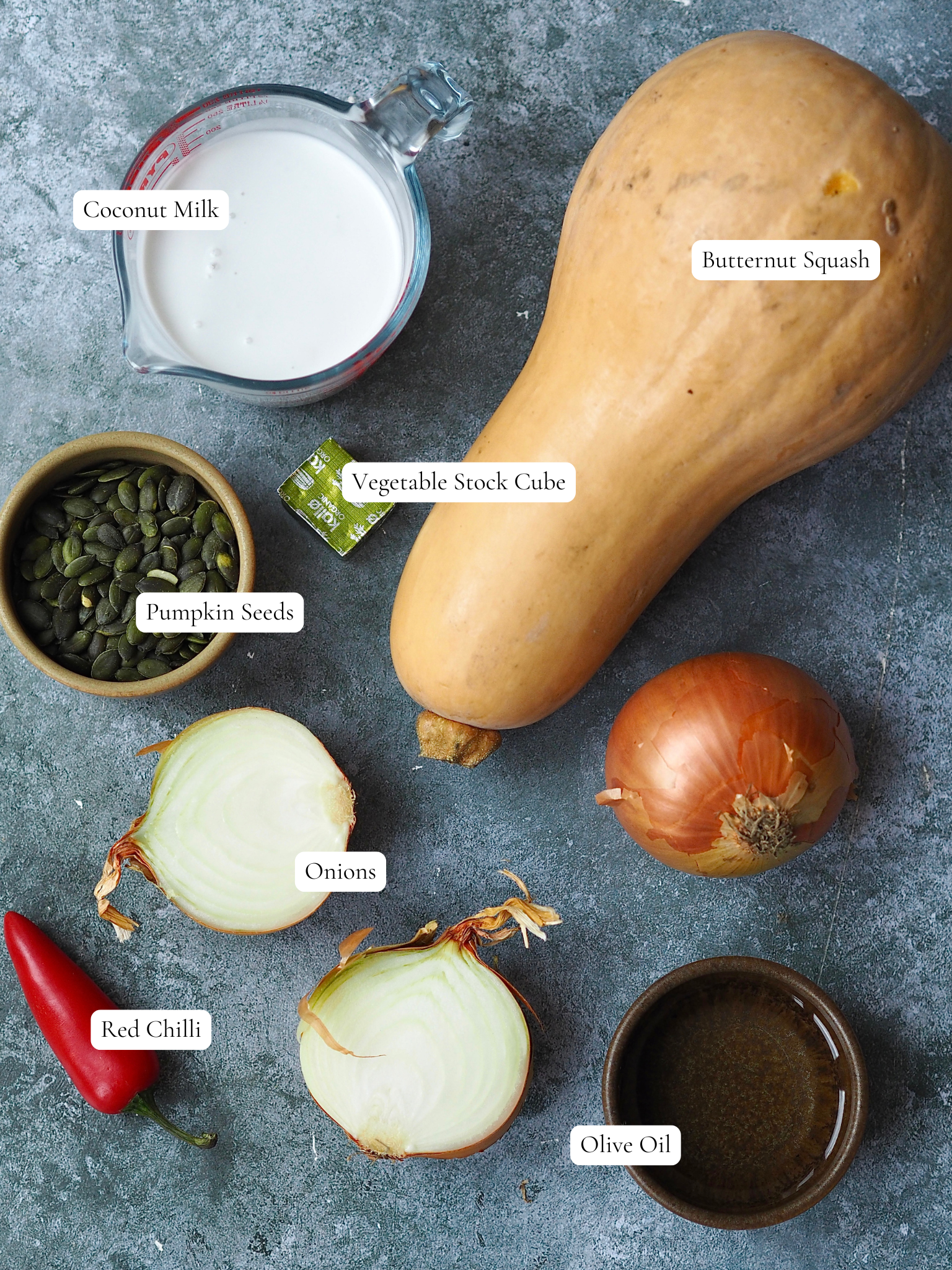 Butternut squash soup ingredients on a grey background. 