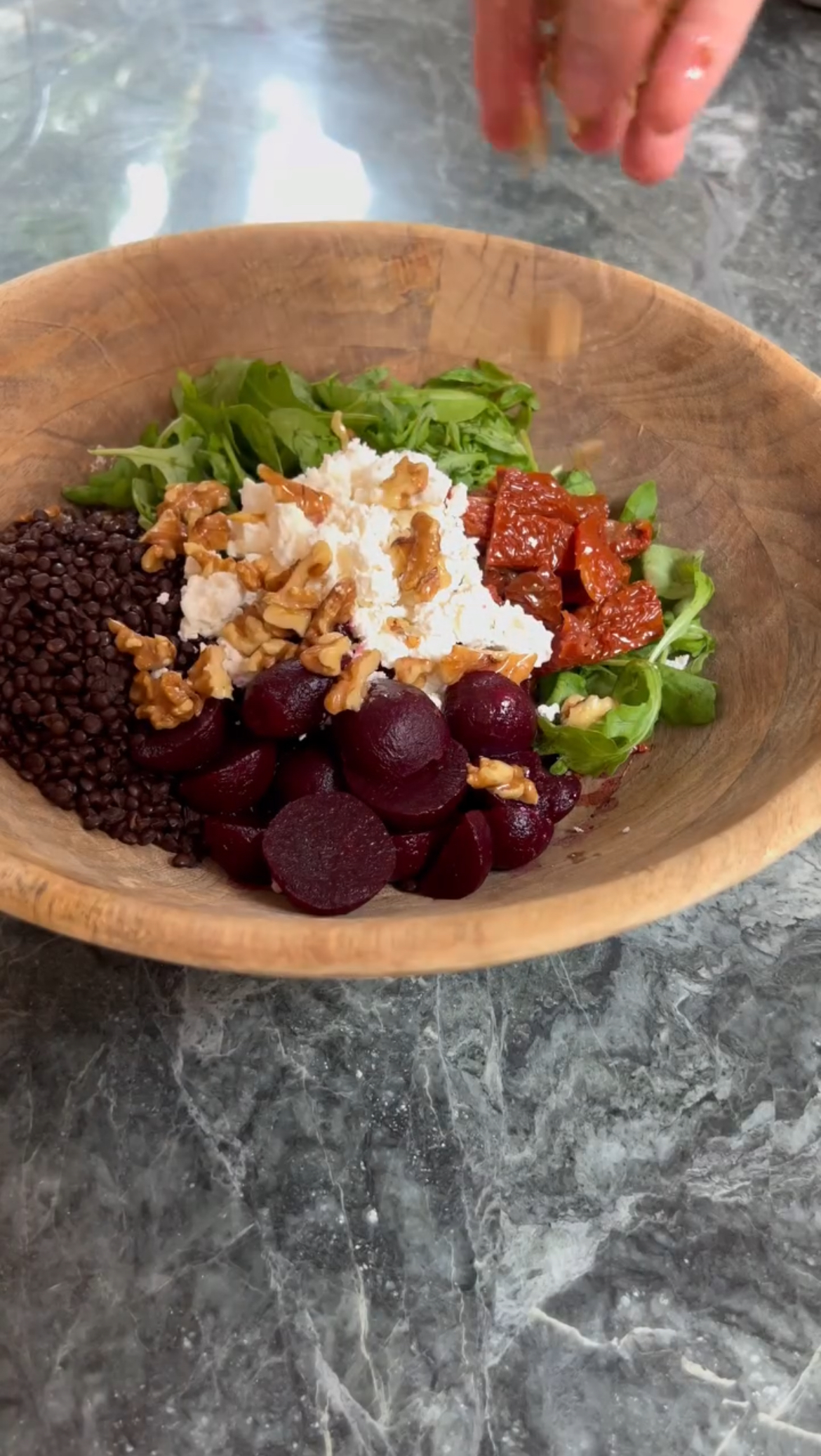 adding walnuts to the salad